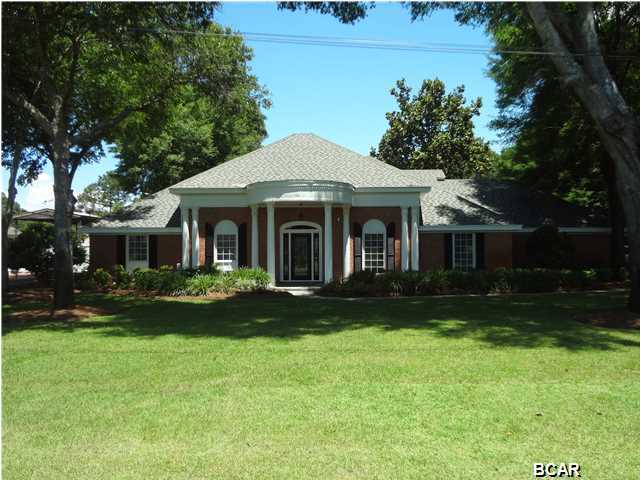 Magnificent Kings Point canal home, totally re-modeled in 2009. This colonial style home is situated on a large .65 acre lot with high elevation overlooking a wide canal. Upon entering you'll be impressed with the crafted curved staircase, high ceilings, and Brazilian cherry hardwood floors. This spacious home will accommodate any family with it's 4 bedrooms, 3.5 baths and/or office and gym. In addition the home comfortably supports two large family living areas each with fireplaces. The re-modeled kitchen will captivate you with granite counters, custom cabinetry, a large island, all stainless appliances along with a gas stove, and culinary details that make cooking a pleasure. Master bedroom downstairs also offers a fireplace along with a luxurious master bath including a pedestal clawed garden tub, separate shower and huge walk-in dressing closet area. Upgrades and additions include surround sound, intercom, video surveillance, butler pantry, mud room, all Anderson windows, custom cabinetry throughout home and more. The exterior offers a sprawling 4 car carport area with storage, a separate workshop with outdoor cooking area, cover brick paver porch, and dog run. A recent $25k investment in landscaping has the outdoor living space and outdoor kitchen in pristine condition. New drain field 12/14. Professional pool plans also available. Canal leads directly into North Bay and on to the gulf. This home is one of a kind, call to schedule an appointment today.