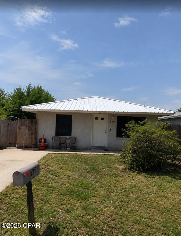 Concrete block and stucco home built in 2001 featuring 2 bedrooms, 1 bath, plus an additional room currently used as a bedroom. Updates include a 2023 metal roof, 2022 tankless water heater, newer refrigerator, and 2017 stove. Backyard features an above-ground pool and storage shed. Conveniently located just 3 blocks from the beach, offering easy access to the Gulf Coast lifestyle. Great opportunity for homeowners or investors!