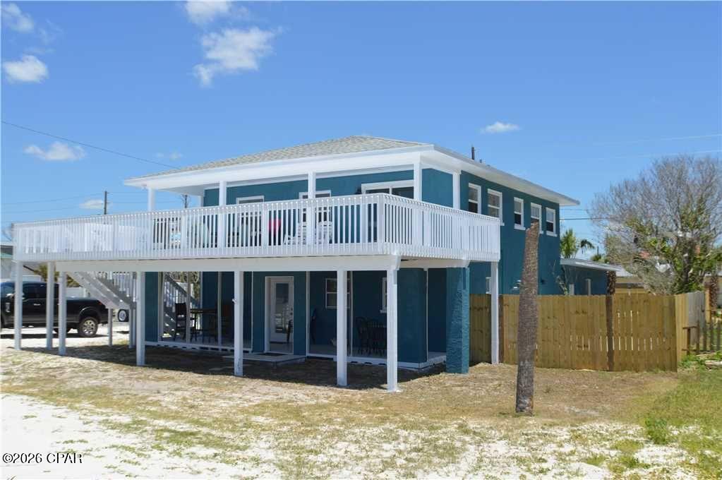 Two story located across from the desired Dedicated Beach in Mexico Beach. Panoramic views of the Gulf of Mexico 24/7. 2BR/1.5B upstairs with kitchen dining living and a wide front porch offering those sunset views. Downstairs is 2BR/1.5B with kitchen dining living and a covered front porch. There is a 2 car attached garage. The fenced back yard has an inground pool.