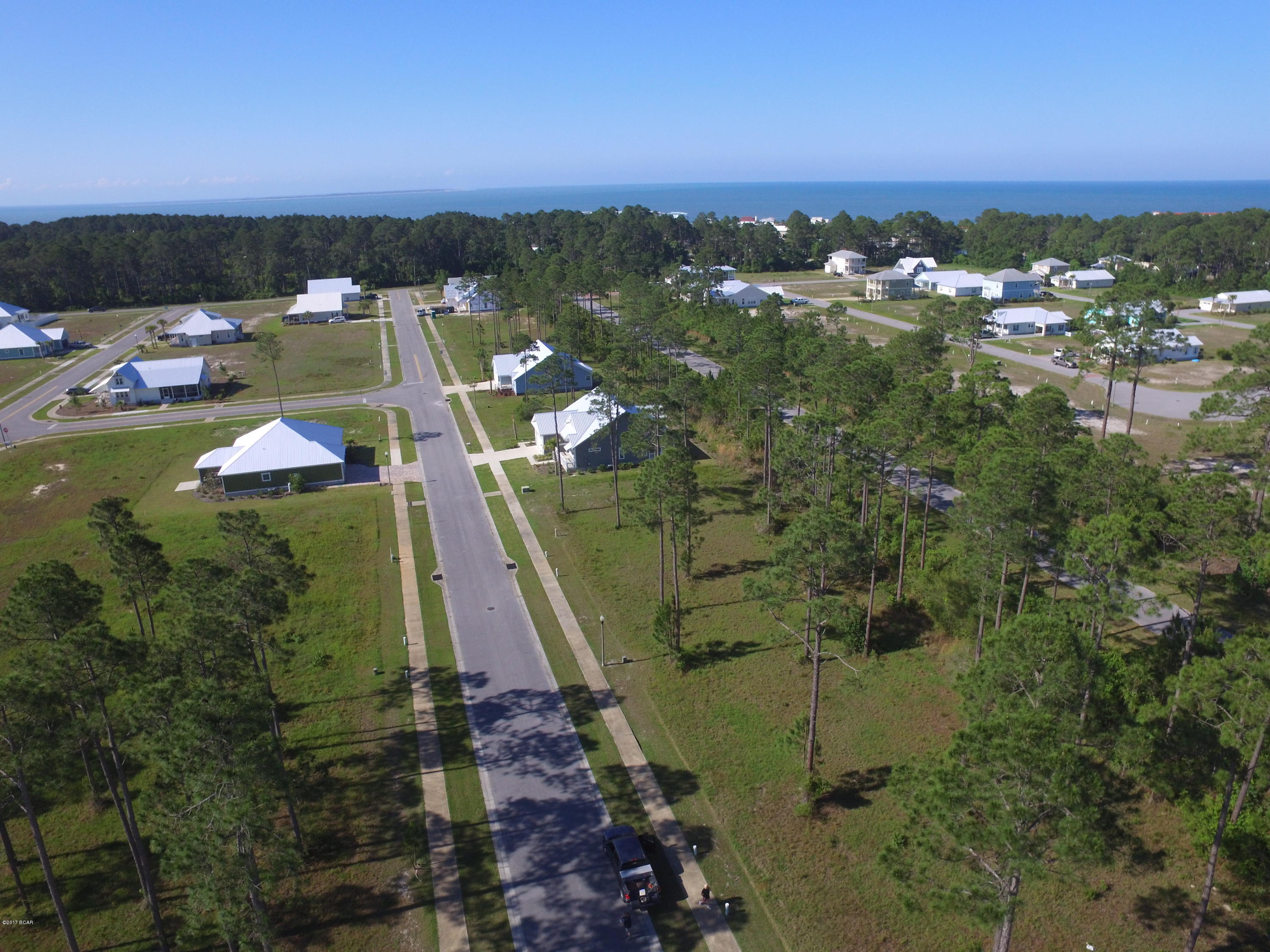 Build your dream home or vacation getaway on this beautiful residential lot in the desirable Casuna subdivision in Mexico Beach. The development has a clubhouse, pool, sidewalks and street lights and is just a short walk or bike ride to the beach, shops, dining and more! This lot is near the cul-de-sac at the end of the road and backs up to a preserve for added privacy. Neighborhood has a coastal design architecture with covenants and restrictions.