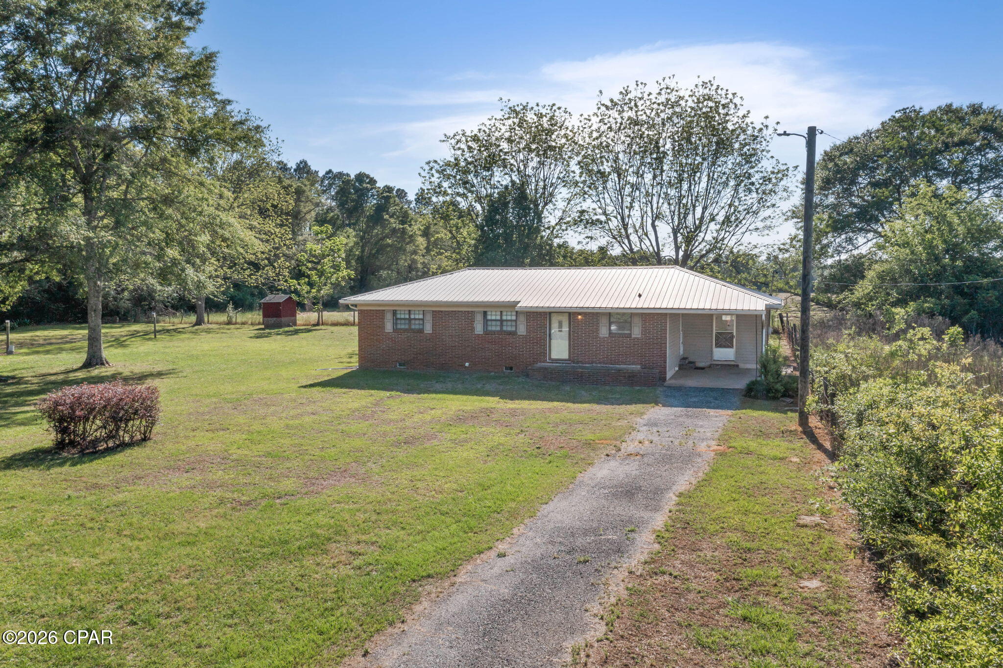 Charming Country Brick Home -- 2 BR, 1.5 BA located minutes from town.

Updated and move-in ready single-story home on a beautiful 1-acre lot. Bright kitchen with abundant cabinets, generous counter space and a breakfast bar; adjacent dining room for everyday meals. Large living room and two nicely sized bedrooms.

Exterior & outbuildings:
- Concrete-floor carport that doubles as a covered patio
- Workshop with lean-tos -- great for mower/yard tool storage
Additional front carport w/ adjacent dedicated washroom/storage 

Comfortable area for country living. 

 Property has plenty of room for a vegetable garden or a flower garden.

 Would be perfect for a starter home or downsizing option.