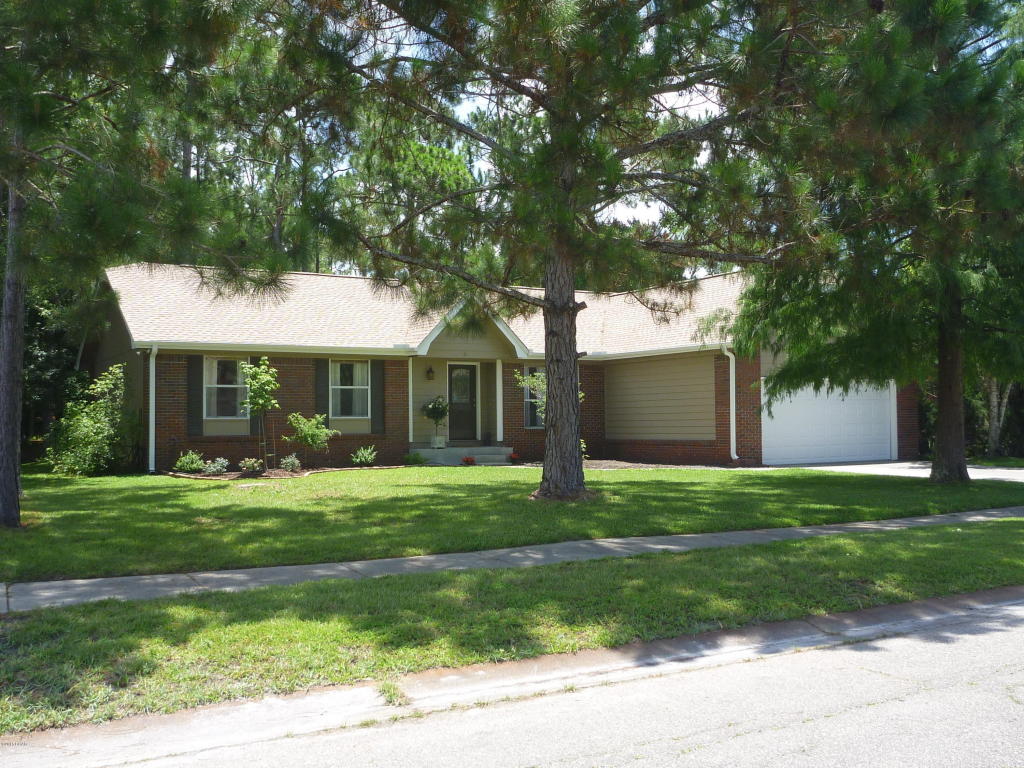 CLOSE TO TYNDALL AFB, immaculate and newly remodeled home that has never EVER flooded!! So much to offer, this home is filled with natural light that makes it bright and inviting. The catherdral ceiling adds to the openness and the 2 french doors to the deck make it bright. The french doors flank a lovely brick, wb/fp for those chilly winter nights. Stunning landscaping gives you lots to enjoy, between the water views and the wildlife in the trees behind the home. Recent renovations on this home include: All new roof!, water heater, a/c, windows, french doors, tile flooring in kit and bathrooms, disposal, granite counters, plumbing fixtures in the kit and baths, dishwasher, and light fixtures. New carpet comes with a transferable lifetime warranty against stains. The Tempurpedic