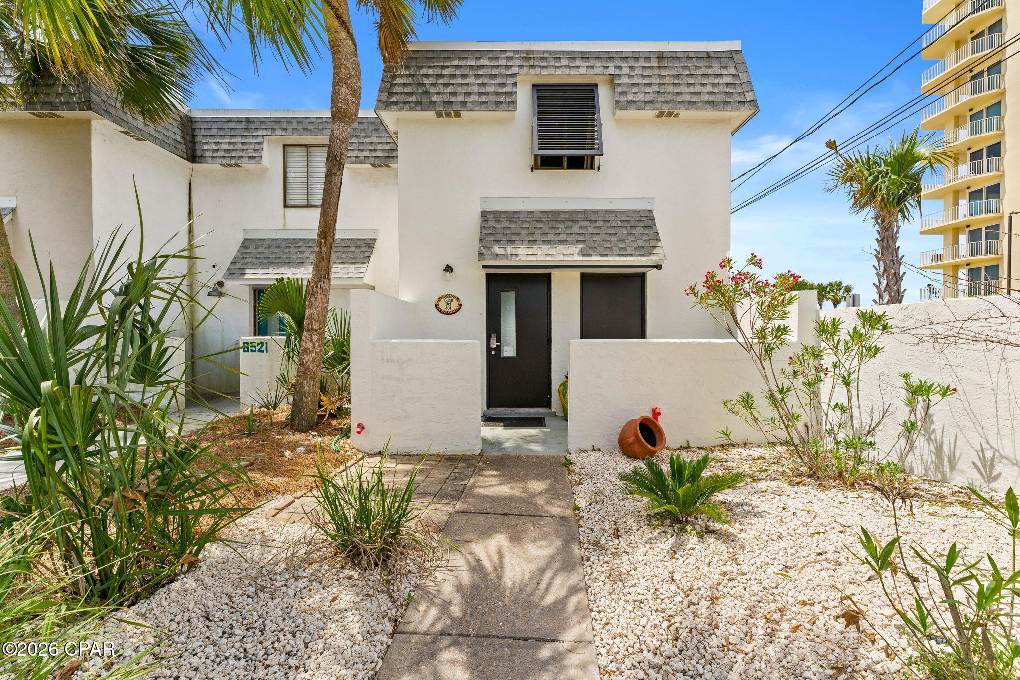 BEST DEAL FOR A GULF FRONT HOME IN PCB. CASA DEL SOL is a beautiful, bright and airy, remodeled end unit next to Beach Access #22 with a Mobi mat for easy walking to the beach. New exterior paint and landscaping. Gulf Front townhome right on the beach with NO HOA  The views and sunsets are amazing along with the Gulf breezes.  All stainless steel appliances, luxury vinyl plank flooring throughout, new dual HVAC systems with new smart thermostats, newer water heater, 3 full baths, and very nice furnishings included. This home also has roll down metal storm shutters that cover both patios, fabric for front door, and Bahama shutter. There is an outside 3x8 storage in the front.