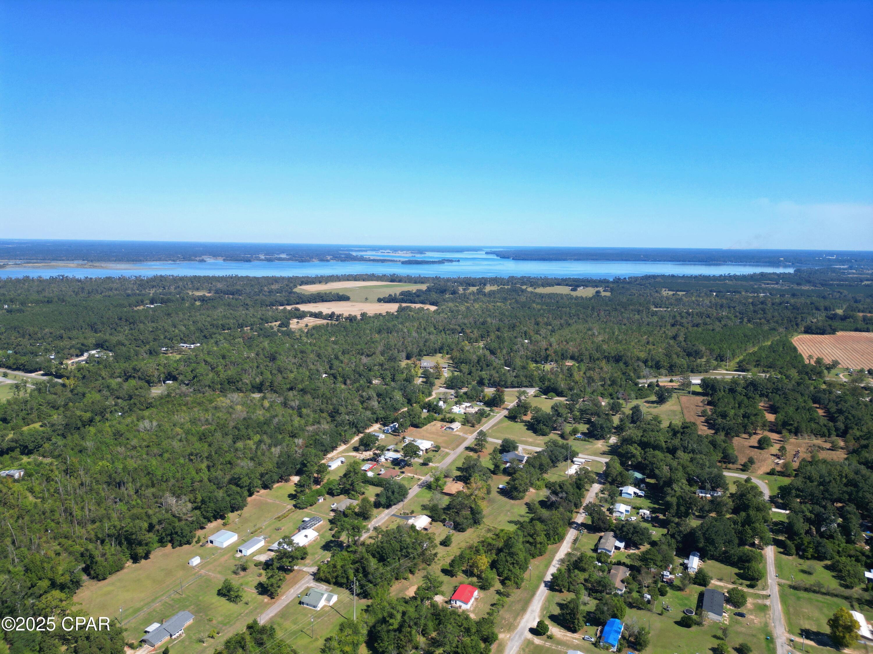 Situated on 1+ acres, just minutes from Three Rivers State Park and Lake Seminole, this well-kept 3-bedroom, 2-bath home is perfectly suited for those who love boating, fishing, and the outdoors. Whether you're in the market for a full-time residence, a weekend retreat, or an income-producing property for short- or long-term rentals, this one offers exceptional versatility.

Inside, you'll find brand new LVP flooring and fresh interior paint, giving the home a bright, updated look. The split floor plan provides both comfort and privacy, with a spacious master suite that includes a garden tub, separate shower, and generous closet space. The open living and dining area features a cozy wood-burning fireplace, while the cheerful breakfast nook is ideal for casual mornings.

The kitchen comes complete with stainless steel appliances, offering both style and convenience for everyday living. With its inviting layout and recent improvements, this home is truly move-in ready with plenty of potential.

Schedule your showing today with your preferred Realtor. Measurements are approximate; buyer to verify if important.