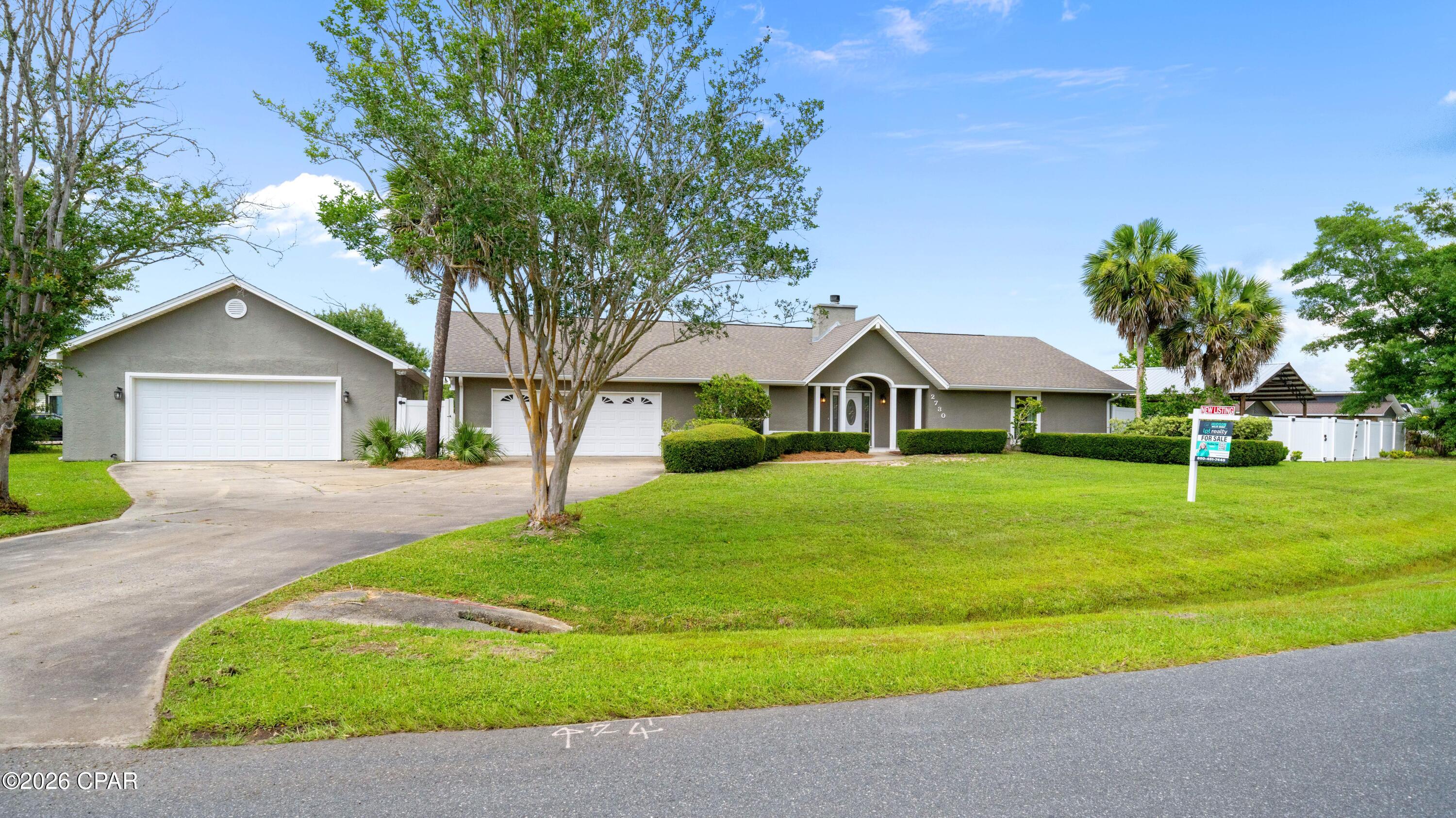 Nestled on a spacious 0.83-acre lot in the heart of Lynn Haven, Florida, this home offers a perfect blend of comfort and space. For those who love to entertain, there's a spacious 30x40 pole barn and a lovely patio area for outdoor gatherings. Additionally, the property includes 2 garages (one attached to the home and the other detached) spacious enough to accommodate up to six cars, along with ample driveway parking.
  Inside, this home features a cozy fireplace and a stunning sunroom that offers picturesque views of your custom saltwater pool. To add to the tranquility of the back yard, a rock waterfall feature in the landscaping is perfect for quiet times in the evening. For those who love to cook, the spacious kitchen is a dream come true, featuring double ovens, a large farmhouse sink, custom cabinets, and brand-new stainless-steel appliances. You'll also enjoy a generously sized laundry room and pantry area with plenty of space for supplies, and a stackable washer and dryer that convey with the property. You will also find spacious bedrooms and luxurious en suite bathrooms with custom walk-in showers. To top it all off, the AC system, heat pump, water heater and pool pumps are all high efficiency meaning this home can save you $$$$ on electric bills. The all-new AC system has all new ductwork and is completely balanced with return air in all rooms.  
 Situated on a corner lot in one of Lynn Haven's most sought-after subdivisions, this home truly has it all.