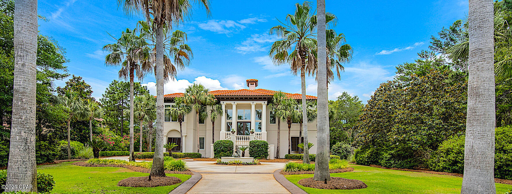 Exceptional grandeur and craftsmanship in this beautiful Burnt Pine home. If you are looking for curb appeal, you have found it. The lush manicured lawns with the sweeping circular drive has 25 enormous palm trees that welcome you into the half acre property that allow you to see golfers hitting their tee shot into the sunset on hole # 5 on Burnt Pine Golf Course. Do this while drinking your favorite beverage and watching the sunset over the water from your 400 sq. ft of screened in entertainment space from the main deck. If you are wanting privacy, this is your place. Hide away on the end of the last cul-de-sac in the subdivision to feel like you are a million miles away from the mainstream but only a golf cart ride from the Marina, Baytown Wharf, Grand Blvd and the Gulf. Gracefully capable of hosting large scale events around the oversized pool to small intimate gatherings with family and friends around the jacuzzi, just outside your wine lounge. The floor plan features ensuite bathrooms per bedroom and all burst open French doors to reveal poolside. When you need a reality break, take the elevator to your office, formal dining room, kitchen or master, all with 12 ft. ceilings on the main level (lower level has 10 fl. ceilings). When you need to roam, just go to your storage packed garage to unplug your Telsa or Golf Cart to be on your way. This is a must see for the discerning buyer.