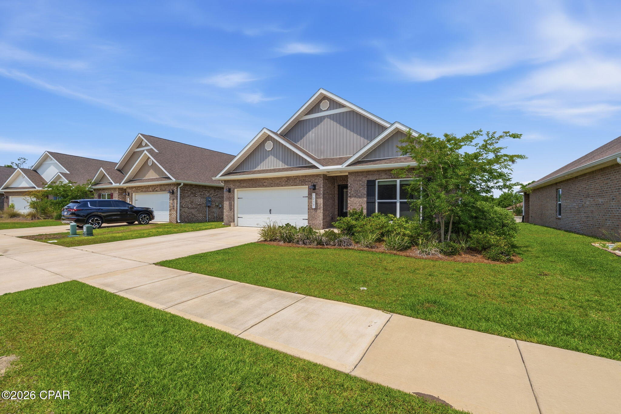 Welcome home to this 4-bedroom, 2-bath brick home located in the popular Andrews  Plantation! Step inside to find luxury vinyl plank flooring in all main living areas, complemented by carpeting in the bedrooms for added comfort. The open-concept kitchen and living room create the perfect space for entertaining, featuring stainless steel appliances, granite countertops, a spacious walk-in pantry, and recessed lighting. The inviting living room boasts an elegant double tray ceiling, while the primary suite offers its own tray ceiling along with a private en-suite bathroom complete with dual vanities, a walk-in closet, a separate shower, and a relaxing soaking tub. All additional bedrooms are thoughtfully situated off the foyer, providing both convenience and privacy. Enjoy outdoor living on the covered back patio, perfect for relaxing or hosting gatherings. Ideally located in the highly sought-after Lynn Haven area, this home is just minutes from shopping, dining, top-rated schools, parks, public boat launches, and more. This one checks all the boxes--don't miss your opportunity to make it yours!