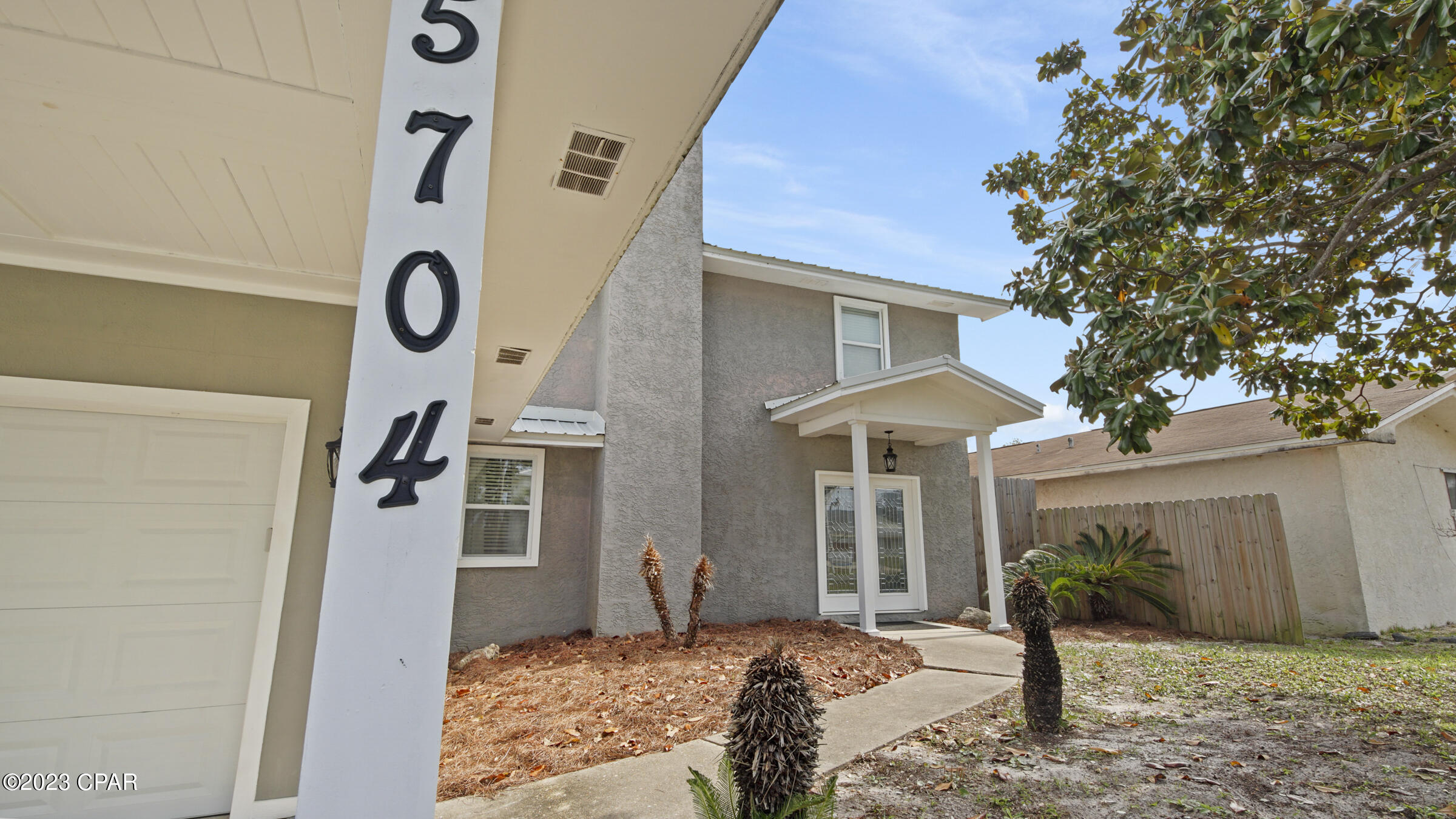 CURRENTLY UNDER CONTRACT, SELLER WILL CONSIDER BACKUP OFFERS.  Step Inside This Beautiful 2 Story Home Which Features 4 Bedrooms, 3 Full Baths, Sunroom, Inground Pool w/Outdoor Shower (Hot/Cold), Outdoor Storage Building, Single Car Attached Garage Along With Having An Attached Carport w/Tall Ceiling Height To Accommodate Larger Vehicles.  This Home Has Been Recently Updated Throughout; With Upgrades Including Beveled-Glass Double Front Doors, Porcelain Flooring, Tile Flooring (No Carpet), Hardwood Steps With Black Wrought Iron Spindles, Tiled Showers, Tall Vanities With Granite In Bathrooms, Beautiful White Shaker Cabinets In Kitchen With Granite Countertops, Subway Tile On Walls, Stainless Steel Appliances, Barn Door, Shiplap And So Much More.  Great Location - Home Situated Between The Beach & The Lagoon. Selling Furnished.  Can Be Used As AirBNB. (Actual Year Built 1984/
Effective Year Built 2014)