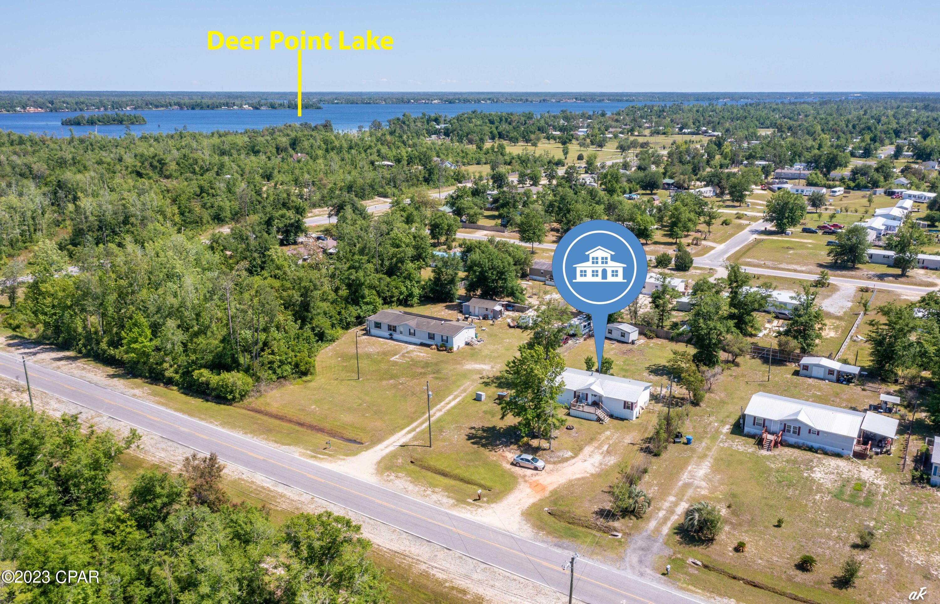 This recently updated 3 bed 2 bath double wide home located by Deer Point Lake in Southport, Florida is a charming and cozy home with a lot size of 0.39 acres. The home has a total living space of 1404 square feet and is designed to offer comfortable living for families or individuals looking for a spacious and affordable home.

The home's interior has been recently updated and boasts fresh paint and new floors, giving the home a modern and inviting feel. The upgraded fixtures in the home provide a touch of style to the overall design. The natural light that fills the home creates a warm and welcoming atmosphere that makes the home feel bright and airy.

The kitchen in the home is equipped with ample counter space, making it perfect for cooking and entertaining. The dining area is adjacent to the kitchen and has enough space to accommodate a family or a group of friends. The living room is spacious and comfortable, perfect for relaxing and unwinding after a long day.

The exterior of the home has a large front and back porch, providing a perfect spot for enjoying the beautiful Florida weather. The lot size offers ample space for outdoor activities and entertainment, making it ideal for families with children or pets. Seller will consider selling fully furnished with an acceptable offer.