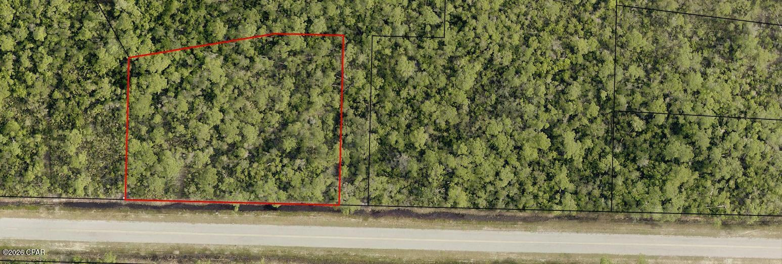 (HUGE PRICE IMPROVEMENT) 

Most people pass right by this stretch of East Bay without ever realizing what's hidden just beyond the road. Tucked inside this quiet pocket sits a .833-acre homesite, offering space, privacy, and a chance to create something special. Originally envisioned as a waterfront community with roads and utilities already in place, the area was set up for growth but time pressed pause. Today, that pause is exactly what makes it so unique, preserving a level of peace and natural beauty that's getting harder to find. Just less than half a mile away, you'll find some of the most gorgeous water in Bay County pristine, full of wildlife, and surrounded by the kind of raw Florida landscape that never gets old. If you're ready to step away from the hustle and bustle and into true serenity, this is one of those rare opportunities that feels like it's waiting on the right person.
More pictures coming soon.