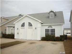 Super immaculate! Like brand new. Seller has installed new tile flooring throughout except the bedrooms have new carpet. Freshly painted. Master bedroom on the first floor, guest 1/2 bath on the first floor. Master bedroom has a screened in porch. Two spacious additional bedrooms upstairs with a jack and jill bath and walk in closets. This well maintained 3/2-1/2 home is in ready to move in condition. Just a block from the beach perfect location with shopping and restaurants. Nice gated community.