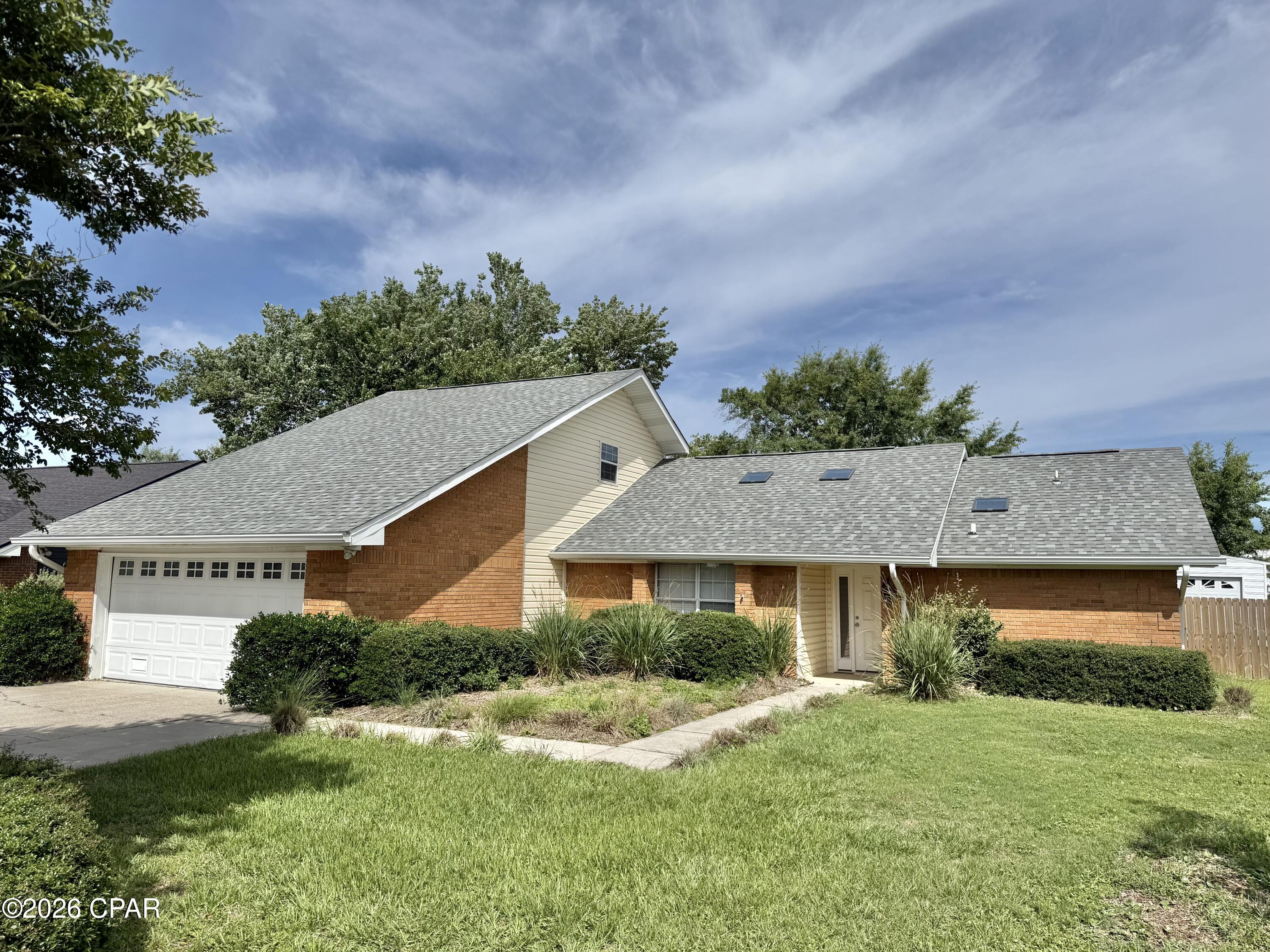 Beautifully remodeled 5-bedroom, 2-bath home in the highly sought-after Derby Woods subdivision of Lynn Haven. Offering more than 2,500 square feet of living space, this spacious home features vaulted ceilings with skylights, tile flooring throughout, a cozy wood-burning fireplace, formal dining room, and an updated kitchen with quartz countertops, stainless steel appliances, and a breakfast area. The oversized primary suite boasts vaulted ceilings, a beautifully updated bath, walk-in closet, and private exterior access.

Step outside to enjoy a large privacy-fenced backyard complete with an open patio, a 14' x 12' storage building, and a 14' x 16' workshop with power and a/c--perfect for hobbies, storage, or additional workspace. Additional upgrades include a 2-car garage with epoxy floor coating, a new HVAC system, and a new water heater.

Located in a golf cart-friendly community, this home is just minutes from Lynn Haven's most popular parks and recreation areas such as Lynn Haven Sports Complex, Isaac Byrd Park, Lauren Merriam Park, Lynn Haven Bayou Park & Preserve, Cain Griffin Park, Leslie Porter Wayside Park, and Sharon J. Sheffield Park. Take a golf cart ride to Isaac Byrd Park and enjoy stunning sunsets over the bay. Combining modern updates, generous living space, exceptional outdoor amenities, and an unbeatable location, this property offers the ideal Florida lifestyle.