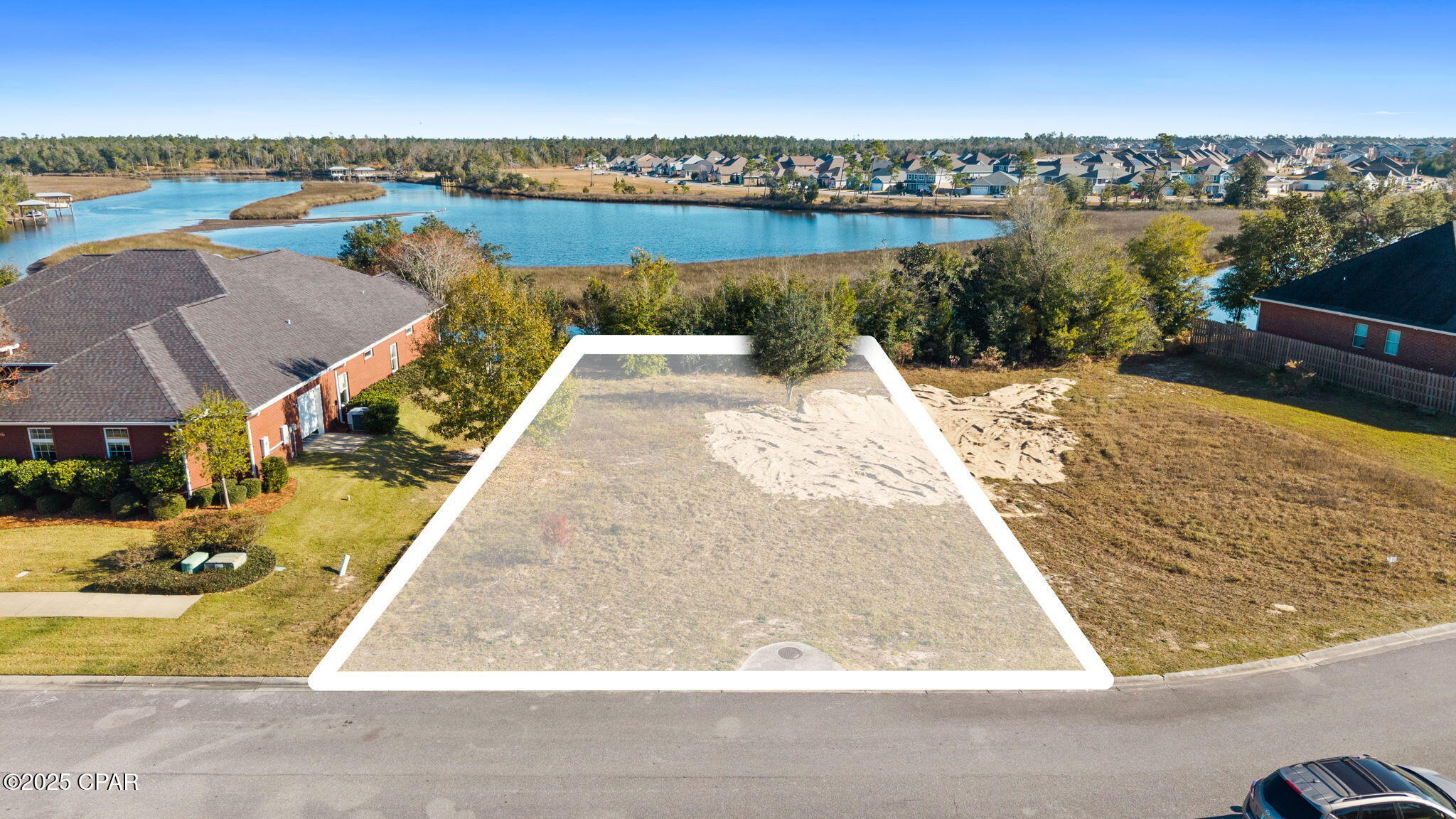 Tucked into The Meadows, 311 Meadowview Terrace offers a solid foundation for the home you've been planning.
This prime homesite is located in a well-established area known for its strong sense of community. The natural setting provides a comfortable balance of privacy and everyday convenience—ideal for those looking to build and settle in.

This waterfront property offers quick access to the North Bay by boat, making it perfect for those who enjoy fishing, paddling, or spending time on the water. In addition, you have direct access to the Gulf.  The Meadows is home to the Nature Walk Golf Club. You can also find local parks, and Lynn Haven's popular shopping and dining options near the neighborhood. Grocery stores, medical facilities, top-rated schools, and other daily essentials are all close by, with easy access to Panama City for work or entertainment.

The lot itself offers a level, build-ready setting with the flexibility to design a home that suits your lifestyle—whether that's a classic Florida residence or a modern design with an outdoor living space. Surrounded by greenery and established homes, this property offers both character and long-term appeal.