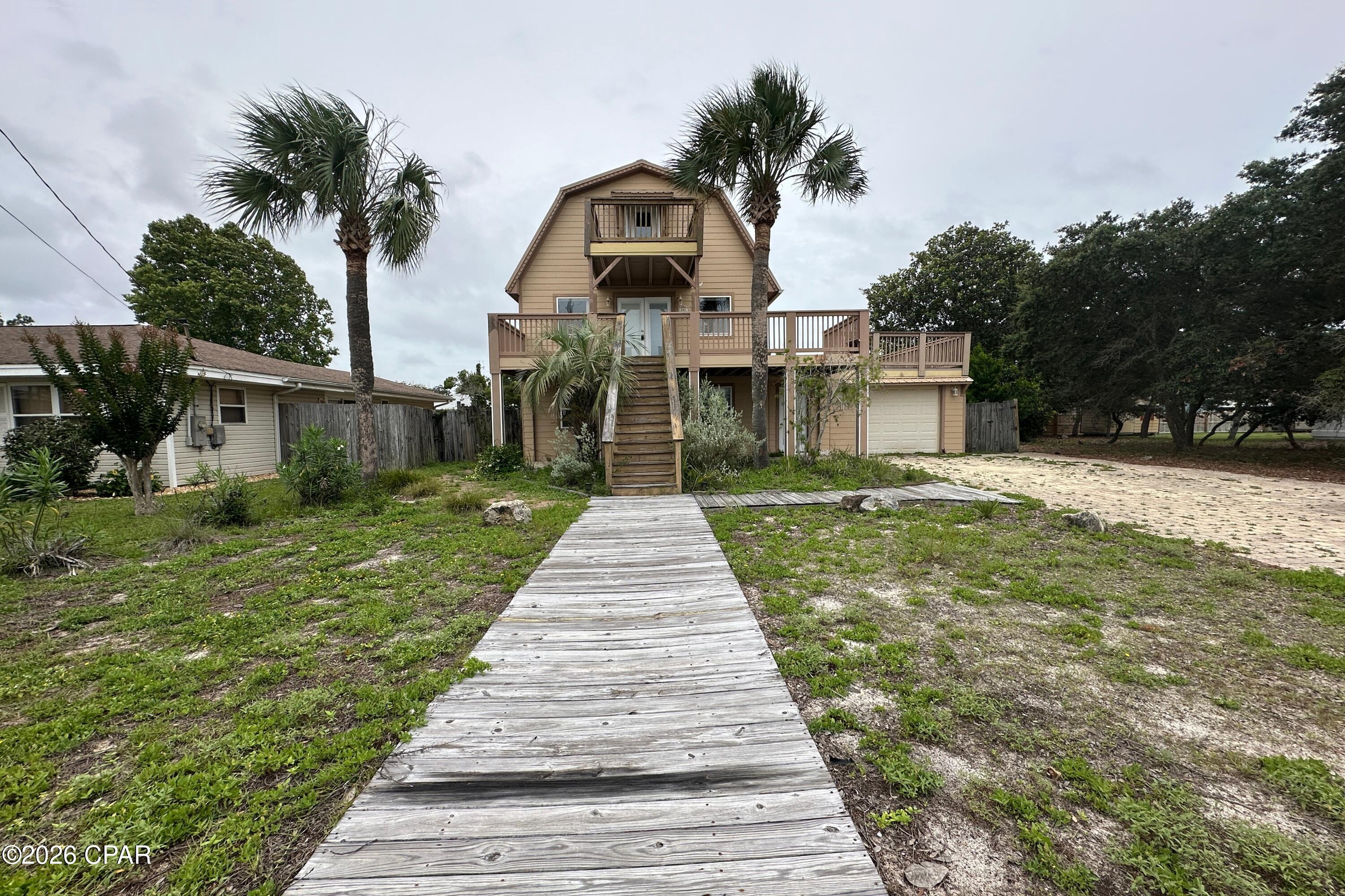 Located in the established Bahama Beach area of Panama City Beach, 501 Lantana Street offers a rare opportunity to create a coastal property just a short distance from the Gulf, Front Beach Rd, local dining, shopping, schools, and PCB attractions. This three-story elevated beach house features 4 bedrooms, 3 full bathrooms, 2,920 sqft per tax records, a private in-ground pool, metal roof, 1-car attached garage, and multiple upper-level balconies/decks.

The home offers a strong footprint, elevated design, outdoor living potential, and a private backyard pool area, all in a location that continues to be one of the most appealing beachside pockets of Panama City Beach. With its size, layout, and proximity to the beach, the property presents a compelling renovation opportunity with room to reimagine the home into a personal beach retreat, second home, or coastal investment property.

Property is being sold AS-IS and will require renovation. Buyer should conduct all inspections and due diligence regarding property condition, financing eligibility, permitting, insurance, flood zone, rental/use restrictions, and all other matters important to buyer.

Some listing photos have been virtually rendered to show potential renovation concepts and are for illustrative purposes only. Renderings do not represent the current condition of the property. Buyer to verify all measurements, square footage, lot size, school zones, property details, and any intended use. Square footage and measurements are per tax records.