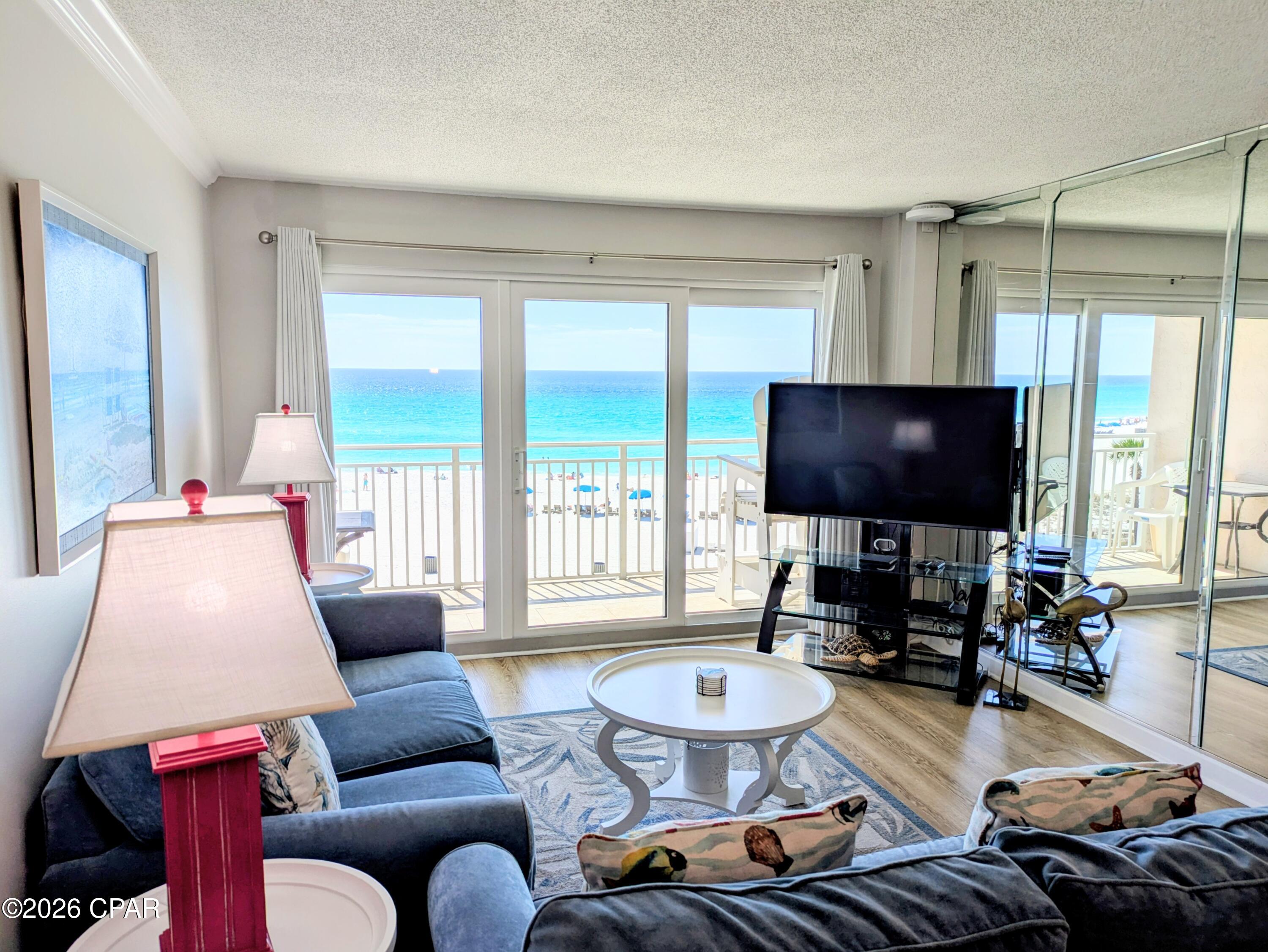 Dunes of Panama D303 is a renovated 2 Bedroom, 2 Bath Condo with 1,050 sq ft of space to unwind, relax and enjoy your Gulf Front condo!  Direct Gulf views from the living room, dining room, kitchen, master bedroom and a balcony that runs the width of the condo!  LVP floors throughout and two beautifully tiled showers!
Beach front living awaits and it is ready to be utilized as a turnkey vacation rental or a second home.  
Currently on the Dunes of Panama Rental Program and includes a set of beach chairs already paid in full for the season! 
Gross rental income: 2024 $46,243, 2025 $47,987
The Dunes of Panama Resort has 1500 linear feet of sugar white sand, 3 gulf front pools (one heated), four pickle ball courts, one tennis court, free WI-FI, fitness room, shuffleboard, outdoor BBQ grills, Stingray's restaurant and gift shop and the Sneaky Tiki poolside. All Milestone report repairs are completed and ALL assessments have been paid! All dimensions and information herein are deemed reliable but should be verified by buyer.
Showers, flooring, toilets and appliances replaced in 2021.
Freshly painted, and new washer/dryer in 2022.
New AC, guest bedroom furniture, coffee and end tables in 2024