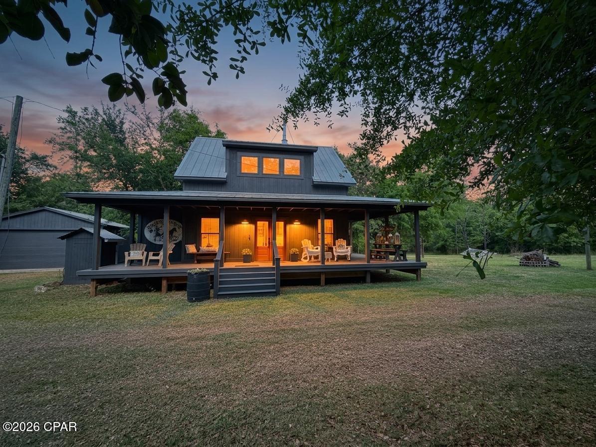Taking Backups the phrase 'CURRENTLY UNDER CONTRACT, SELLER WILL CONSIDER BACKUP OFFERS' 
Experience the perfect blend of modern comfort and rustic charm in this beautifully crafted 2-bedroom, 2-bathroom modern farmhouse. Every detail has been thoughtfully designed, showcasing custom finishes throughout--from the striking wooden beam ceilings that add warmth and character, to the built-in bunk beds with elegant brass railings that create a one-of-a-kind space for guests or family.

The home's functional spaces are equally impressive, featuring a stylish laundry room with eye-catching herringbone tile flooring and expertly designed bathrooms that offer both sophistication and comfort. In the living room, custom-built bookshelves frame a sleek electric fireplace, creating a cozy yet refined focal point ideal for relaxing or entertaining. The living room is open to your dining area and chef's kitchen w/ stone counters & marble backsplash. 

Upstairs, the private primary suite is a true retreat, complete with a luxurious soaking tub that overlooks the serene surrounding land, as well as a separate shower for added convenience.

Step outside and embrace the peaceful lifestyle this property offers. Enjoy quiet mornings or evening gatherings on the expansive wraparound front porch, or unwind on the side deck surrounded by nature and bordering Florida Caverns State Park. For a truly unique touch, the galvanized outdoor shower lets you refresh while immersed in the natural setting.

Additional features include a detached garage with a roll-up door--perfect for parking, hobbies, or storage--along with a barn featuring double-door entry and a separate storage building, providing ample space for equipment, tools, or creative use.

This property is more than a home--it's a private escape where thoughtful design meets tranquil living close to town. Additional 9.98 acres possibly available for purchase or lease.