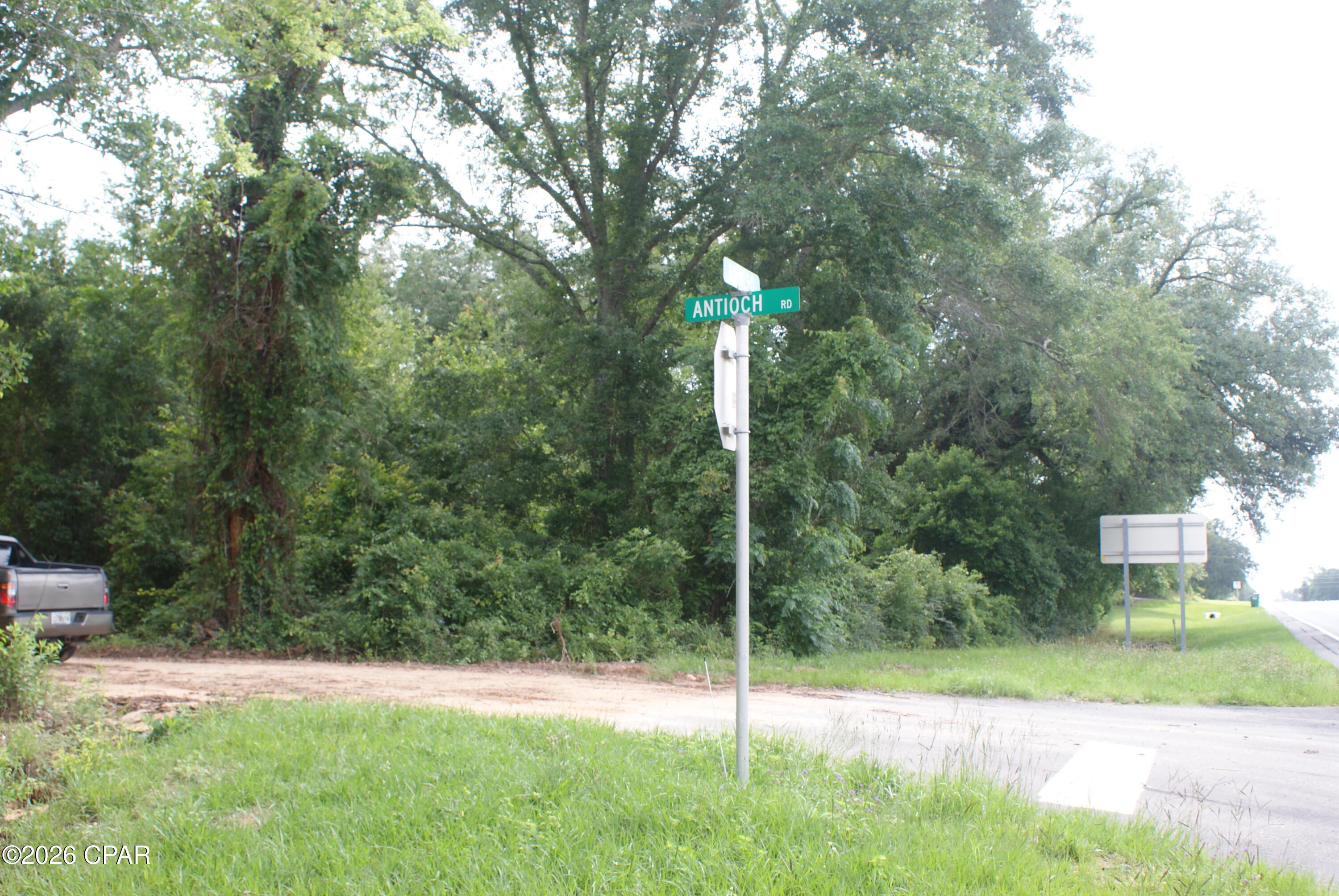 Facing Highway 90, wooded 3-acre parcel conveniently located on the corner of Highway 90 and Antioch Road, approximately 2 miles from downtown Marianna and downtown Cottondale. The parcel is directly across the highway from the National Guard Amory.
