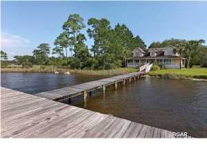 LARGE HOME ON BEAUTIFUL LAKE POWELL. OPEN FLOOR PLAN ON BOTH FLOORS. LARGE BEDROOMS, UNIQUE DECOR, APPLIANCES, TWO A/C UNITS, GORGEOUS MATURE LIVE OAKS ON THE PROPERTY. BOAT DOCK ALREADY IN PLACE FOR LAKEFRONT LIVING. LARGE FRONT PORCH PROVIDES THE PERFECT VIEW OF THE LAKE. JUST OVER A MILE AWAY TO THE WORLD'S MOST BEAUTIFUL BEACHES AND MINUTES AWAY FROM 30A AS WELL AS ALL THE SHOPPING, RESTAURANTS, AND FUN AT PIER PARK, THE LOCATION IS UNBEATABLE. ENJOY THE RELAXING LAKEFRONT LIFESTYLE WHILE HAVING THE BEACH FUN AND SHOPPING A SHORT DISTANCE AWAY.