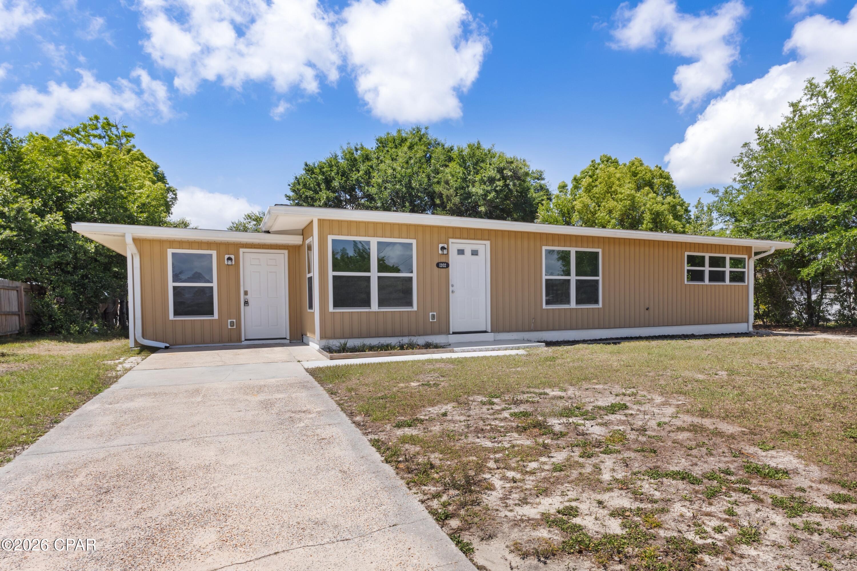 CENTRALLY LOCATED HOME IN FOREST PARK! This inviting home features a bright and semi-open layout filled with natural light and stylish blonde vinyl plank flooring throughout. The split floorplan offers added flexibility, with a bedroom suite located on one side of the home including a full bathroom, a walk-in closet with washer and dryer hookups, and a separate entrance. This versatile space could also be used as a second living area or home office. On the opposite end, you will find three bedrooms and a full bathroom.  The updated kitchen is equipped with stainless steel appliances, granite countertops, a pantry, and a large sink overlooking the backyard.  The exterior has a good size, partially fenced backyard and a back deck, great for grilling or entertaining guests. This home is conveniently located just minutes from shopping, dining, schools, and everyday amenities. There is no HOA and the property is located in an X flood zone. Schedule your private showing today. Measurements are approximate.