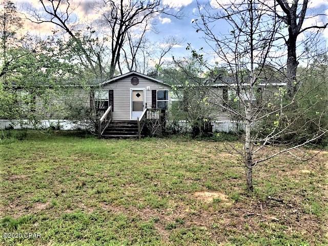 * PRICE REDUCTED * This is a doublewide mobile home with little or no value.  You can renovate it if desired or remove it.  There is a large garage/workshop on the property. All of this is on 2.510 acres of land in the country.  It would be a great project for investment property or to make it into a permanent home for you.