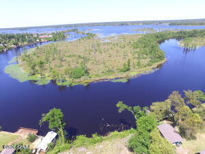 Excellent opportunity! 3 individual parcels of land in the country in 1 fabulous waterfront package!
With 166 feet on an open canal that feeds right into beautiful Deerpoint Lake and 2 other identical parcels making up 1 property, this will be the perfect lots to build your dream home! This listing includes the WATERFRONT. half acre lot at 1923 Indian Bluff Resort Lane and 2 identical lots right across that are .67 and .61 acres each (9522 and 9524 Indian Bluff Rd) which is paved! The total acreage combined is just under 2 acres! You can enjoy boating, tubing kayaking and more with afternoon sunsets right out your back yard - and never have to leave home to enjoy the Florida dream!
