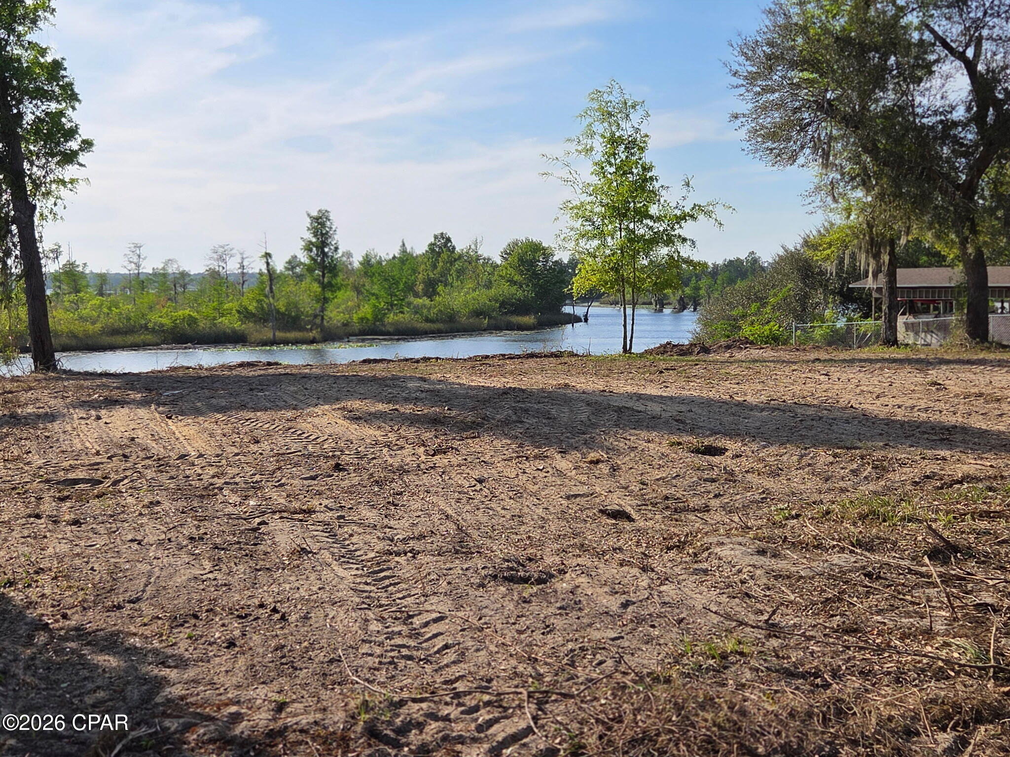 Excellent opportunity! 3 individual parcels of land in the country in 1 fabulous waterfront package!
With 166 feet on an open canal that feeds right into beautiful Deerpoint Lake and 2 other identical parcels making up 1 property, this will be the perfect lots to build your dream home! This listing includes the WATERFRONT. half acre lot at 1923 Indian Bluff Resort Lane and 2 identical lots right across that are .67 and .61 acres each (9522 and 9524 Indian Bluff Rd) which is paved! The total acreage combined is just under 2 acres! You can enjoy boating, tubing kayaking and more with afternoon sunsets right out your back yard - and never have to leave home to enjoy the Florida dream!