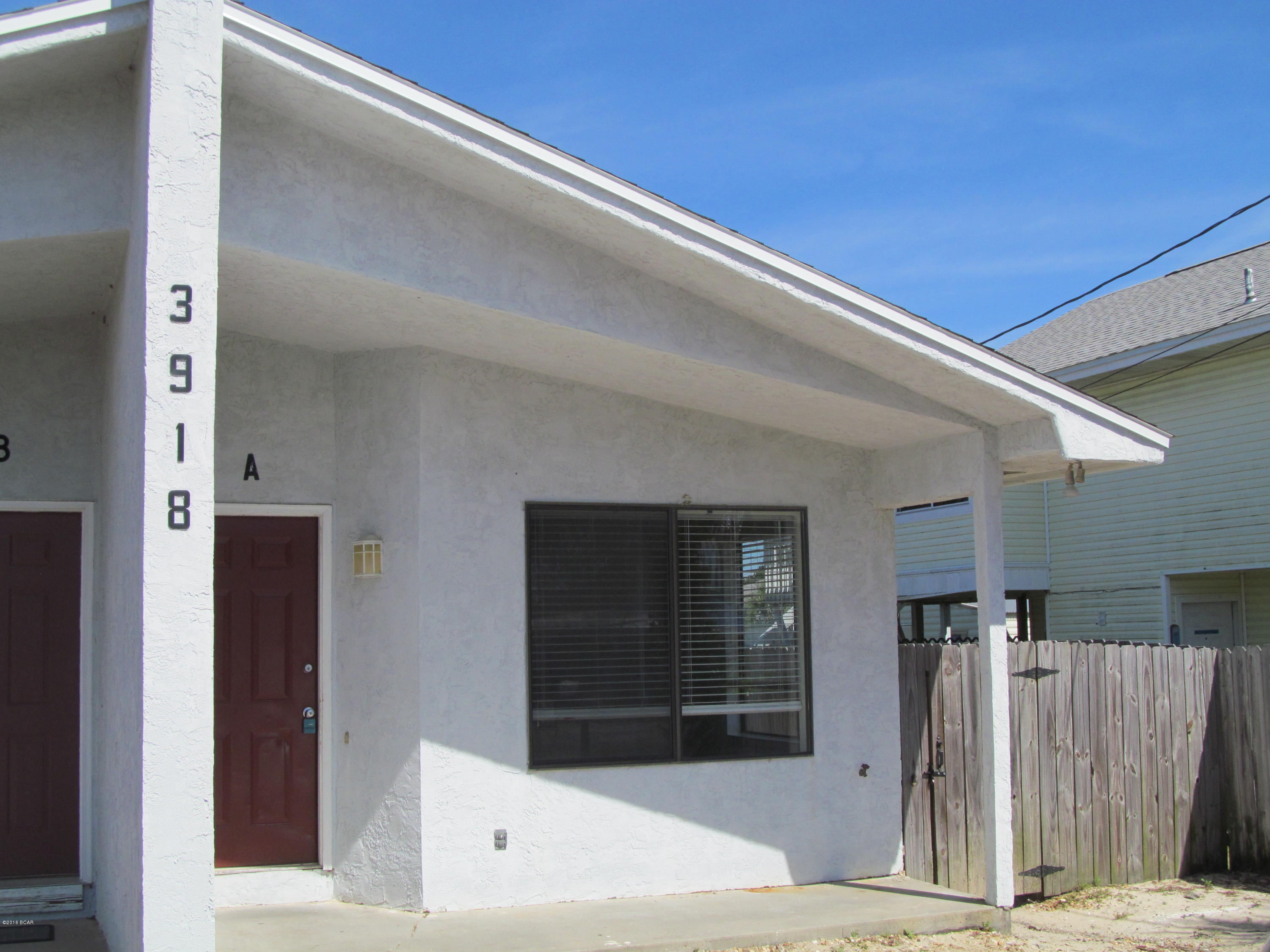 Walk to the beach- 1 bedroom 1 bath duplex- new flooring- newly painted- breakfast bar- laundry area for full size washer & dryer. This home offers a patio &  shared fenced back yard for semi privacy.

Lawn service is included- this property is on septic.