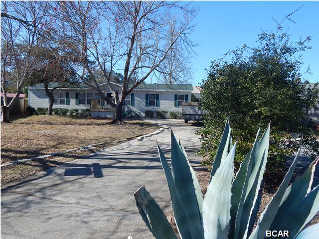 Clean and well maintained Custom built Cavalier Mobile Home in the North Lagoon Oaks Subdivision. Floor plan consist of a split bedroom with all rooms relatively large. Vaulted ceilings add to the open and spacious feeling of the home. Walk in closets in all the bedrooms. There is a formal dining area and separate washer and drier room (washer/drier stays). Kitchen is large with breakfast bar and gas stove. The master bedroom has vaulted ceiling, large vanity sink, a separate make up vanity and large shower. The screened in porch is surrounded by secluded back yard with 10' privacy fence. You have an above ground pool surrounded by a custom built cedar deck for those hot summer months. Sprinkler system is on a shallow well and several yard buildings stay. The roof is only 2 years old
