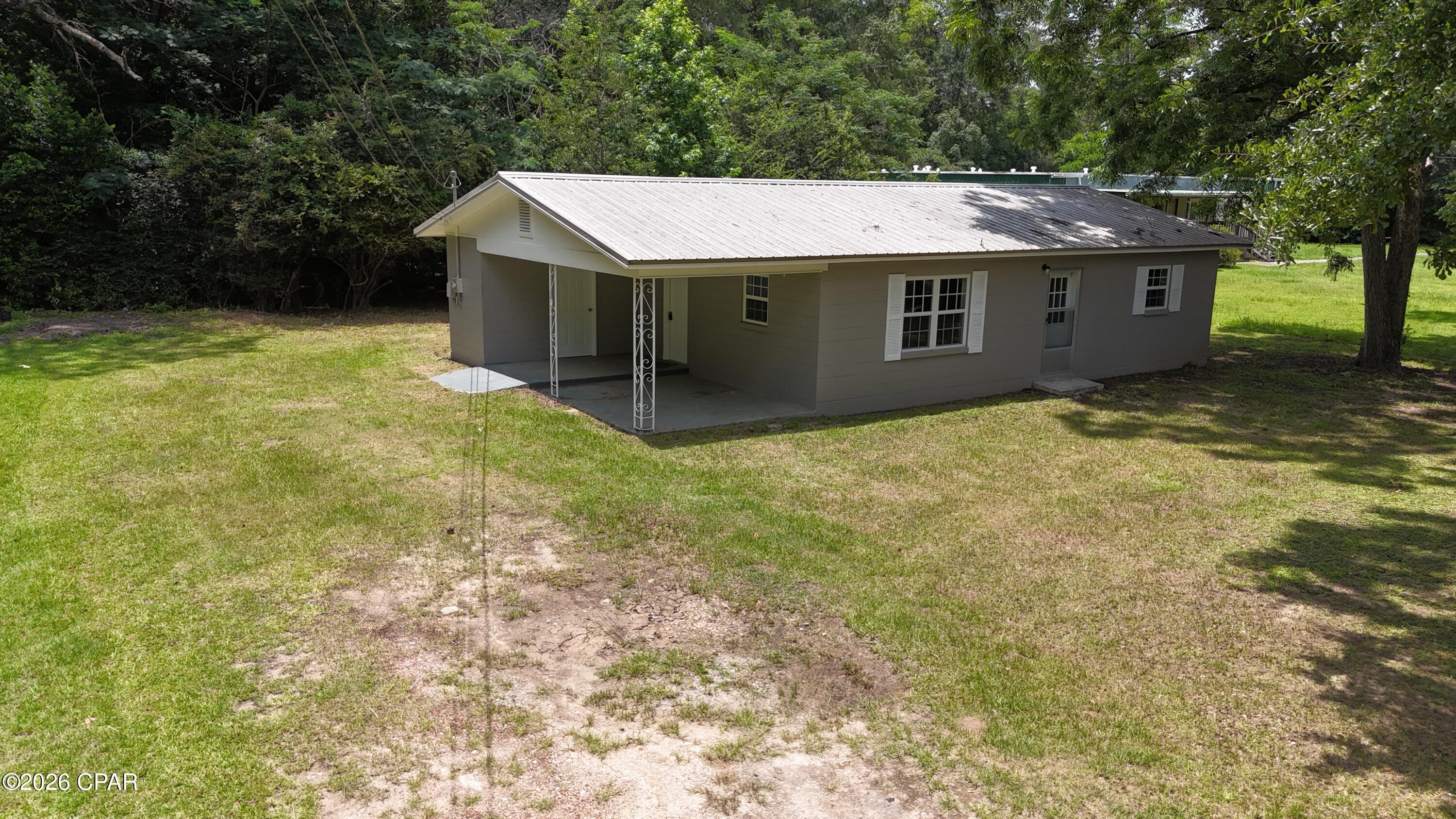 Charming like new Move-In Ready Home in Graceville, Florida. Welcome home to this beautifully updated block home situated on a spacious 0.35-acre lot along a quiet city street in the heart of Graceville. New windows, doors, appliances, air conditioning, floors, cabinets, countertops, sinks, fixtures, bathroom, and paint inside and out. This property offers the perfect blend of small-town living and modern updates, making it an excellent choice for first-time homebuyers, retirees, or investors.
Inside, you'll find numerous recent improvements, including new windows, new cabinetry, new countertops, new flooring throughout, a new shower/tub combination, a new refrigerator, and a fresh coat of paint that gives the home a bright, clean feel. The home is equipped with central heating and air conditioning for year-round comfort.
Enjoy the convenience of city water and sewer service, along with the peace and quiet of an established neighborhood. The generous lot provides plenty of room for outdoor activities and gardening. As an added bonus, you're located just over an hour from Panama City Beach, home to some of the world's most beautiful white-sand beaches and emerald-green waters. If you're looking for an affordable, updated home that's move-in ready and conveniently located, this Graceville gem deserves a closer look.