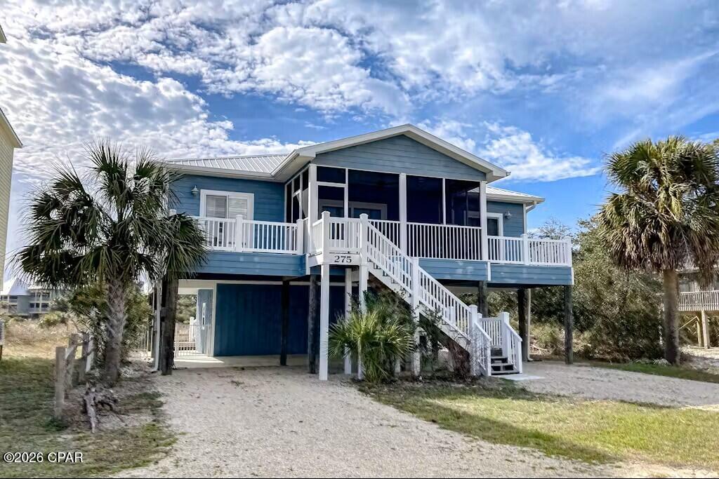 Welcome to coastal living at its finest at 275 Moonrise Avenue on beautiful Cape San Blas. This inviting 3-bedroom, 2-bath home with a versatile bonus room and elevator offers the perfect balance of comfort, functionality, and beachside charm. Inside, the thoughtfully designed floor plan creates a natural flow between the main living spaces. Large sliding glass doors invite in abundant natural light, enhancing the open-concept living area and creating a warm, welcoming atmosphere. On cooler evenings, the fireplace provides the perfect setting to relax and unwind. The kitchen is both stylish and practical, featuring modern appliances, generous counter space, and custom cabinetry--ideal for preparing meals while staying connected with family and guests. Just off the kitchen, the dining area offers a comfortable space to gather and enjoy memorable meals together. The primary suite serves as a peaceful retreat, complete with a private balcony offering peek-a-boo Gulf views. The ensuite bath is designed for relaxation with a soaking tub, separate shower, and dual vanities. Two additional bedrooms provide comfortable accommodations for family or visitors, while the bonus room offers flexibility as a home office, media room, or additional guest space. Outdoor living is equally enjoyable with a spacious deck perfect for soaking up the sun, dining outdoors, or enjoying the coastal breeze. With private beach access just moments away, you're only steps from the sugar-white sands and emerald waters of the Gulf. Whether you're searching for a full-time residence, a relaxing vacation escape, or a strong investment opportunity, this Cape San Blas home offers an exceptional opportunity to enjoy the best of the Forgotten Coast lifestyle.