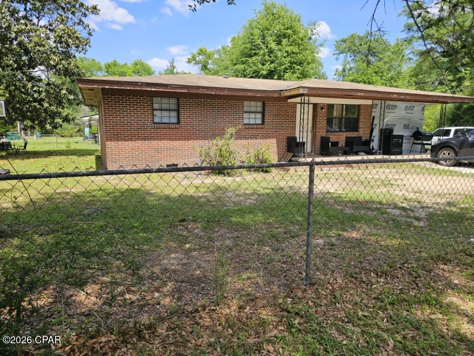 Brick home with great potential: a 4-bedroom, 2-bath residence on a corner, fenced lot inside the city limits. Currently a rental and in need of some TLC, this property offers solid bones and a chance to create instant equity for the right buyer--whether you're an investor or an owner-occupant ready to customize your next home. City utilities are in place with public water and sewer, simplifying maintenance and planning.  Some photos are virtually staged.