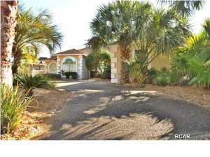 This is a gorgeous Bay Point canal home that sits at the end of Trout Dr. on the Cul-de-Sac. You drive into a circular driveway surrounded by tropical landscaping and lots of palm trees. This 3-bedroom, 2 1/2 bath home also has an extra room which makes an ideal office or library, and could even be utilized as a small 4 th. bedroom. The modern construction offers 10-foot ceilings throughout the house with x-large crown moldings, large and numerous 6-foot windows with transom windows overhead to let in all the natural light and several large arched windows. Large 18' diagonal tile throughout. Starting with the kitchen you have a big wide open cooking area with double ovens and gas range and plenty of cabinetry. The kitchen opens up into a nice breakfast area and family room which all