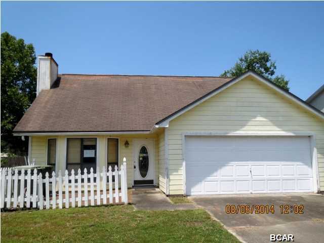 ATTRACTIVE TWO-STORY HOME IN LYNN HAVEN! The home features a large living room with a fireplace, cathedral ceiling, full kitchen, half bath and parquet floors throughout the first floor. The Master bedroom is on the first floor and has an updated Master bath and hall laundry closet. The second floor has two bedrooms and a full bath. This home needs some interior and exterior repairs, but it has loads of potential. This one is perfect for a renovation loan!