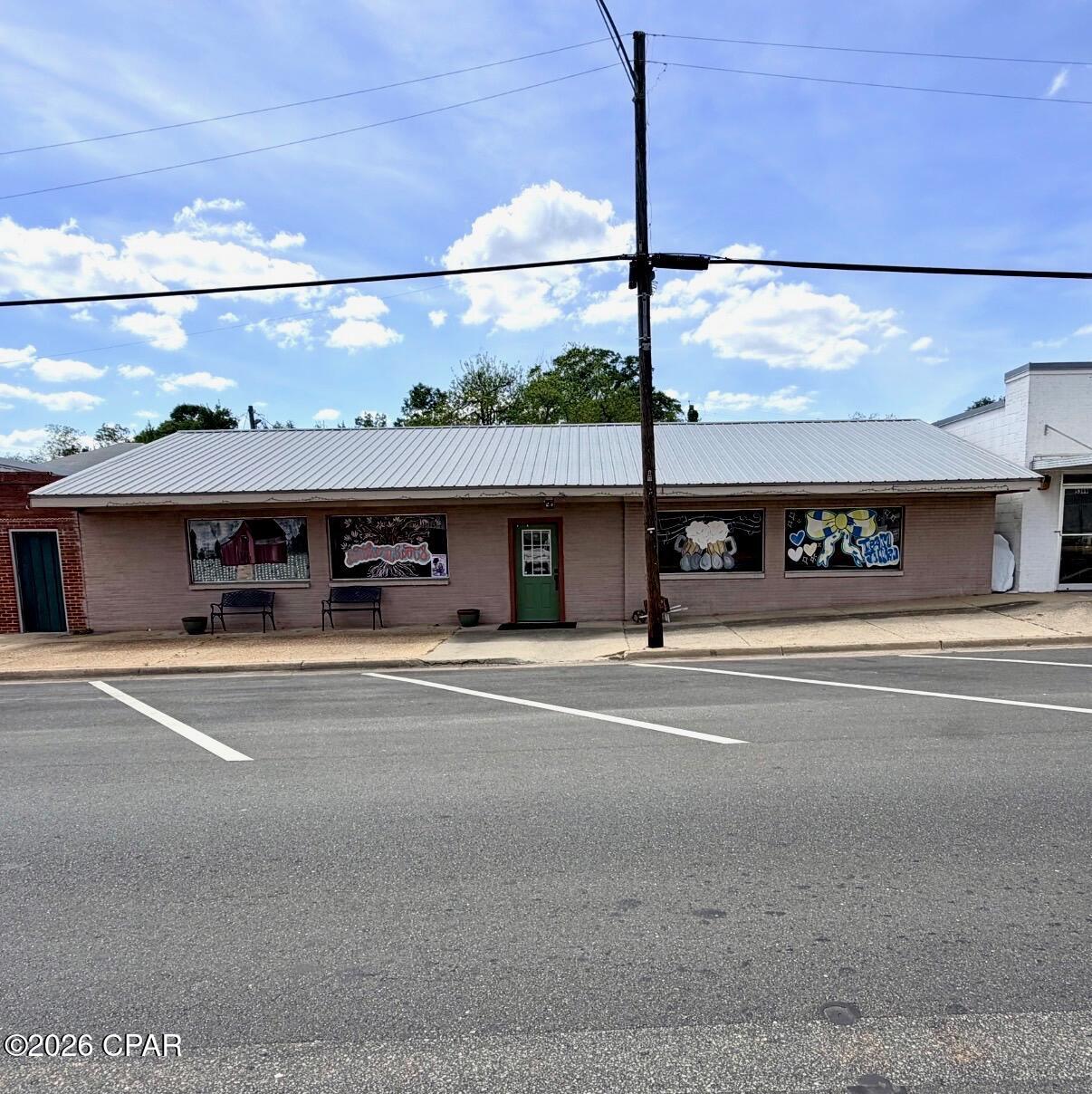 Welcome to an incredible commercial opportunity in the heart of Malone, Florida--where small town charm meets big potential. This established restaurant space is ready for its next owner, whether you continue the current concept or bring something entirely new to the community.



-Active restaurant tenant already in place - instant income potential

-Spacious dining area with multiple seating arrangements and open layout

-Large custom bar area perfect for gatherings, events, or expanded service

-Fully equipped commercial kitchen with hood system, prep space, and stainless fixtures

-Two guest bathrooms for convenience and compliance

-Multiple storage rooms for inventory, supplies, and operations

-Unique interior with character, local charm, and a laid-back atmosphere customers love

-Outdoor fenced area with picnic tables - ideal for expanding into outdoor dining or events

-Some furniture, fixtures, and equipment negotiable with sale



This property isn't just a building--it's a chance to be part of the growing movement of revitalizing small towns. Malone is the kind of place where good food, good people, and strong community still matter--and businesses like this become staples.



Whether you're an investor looking for income, an owner-operator ready to step in, or someone with a vision to create the next local hotspot!
