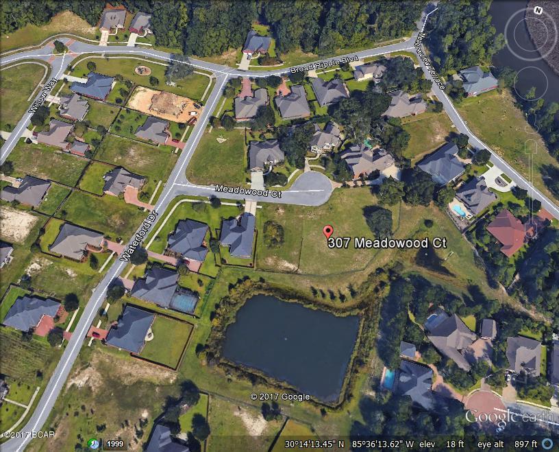 Fantastic building lot in The Meadows, a golf community in the center of the growing city of Lynn Haven. Lot views overlook small pond landscaped with trees. Plenty of room for a pool and outdoor grilling kitchen.