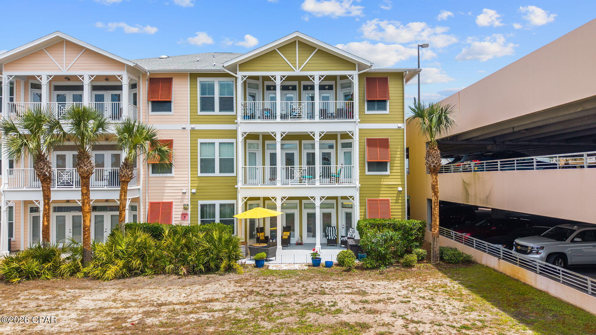 ''Easiest access in the building--first floor with covered parking, and priced aggressively to be the best 2-bed value in the community.  Experience the ultimate in coastal convenience and privacy in this stunningly renovated ground-floor end unit at Island Reserve. Perfectly positioned as the closest residence to the parking garage, this home makes daily errands effortless, while its unique location--with no neighbors directly behind--ensures a level of tranquility rarely found in a condo. The interior is a masterclass in modern design, featuring an open-concept living space with luxury vinyl plank flooring and a chef's kitchen anchored by a massive island. Custom floor-to-ceiling cabinetry with built-in pull-outs, quartz countertops, and a premium Samsung appliance suite including induction cooktop, make the kitchen as functional as it is beautiful.   ''Life-Proof'' engineered wood floors are absolutely beautiful!

The thoughtful layout provides a private sanctuary for everyone, with each bedroom boasting its own ensuite bathroom, plus a convenient guest half-bath in the foyer. The primary suite is a true retreat, offering direct patio access and a spa-like bath with a soaking tub and separate tiled shower. Beyond your door, the gated community offers unparalleled amenities, including a massive resort-style lagoon pool with a waterfall, a fitness center, basketball (and pickleball) courts, and a private theater. Tucked away for peace and privacy yet just minutes from the sugar-white sands and vibrant energy of Panama City Beach, this condo offers the best of the Gulf Coast lifestyle.  Welcome home to Island Reserve!