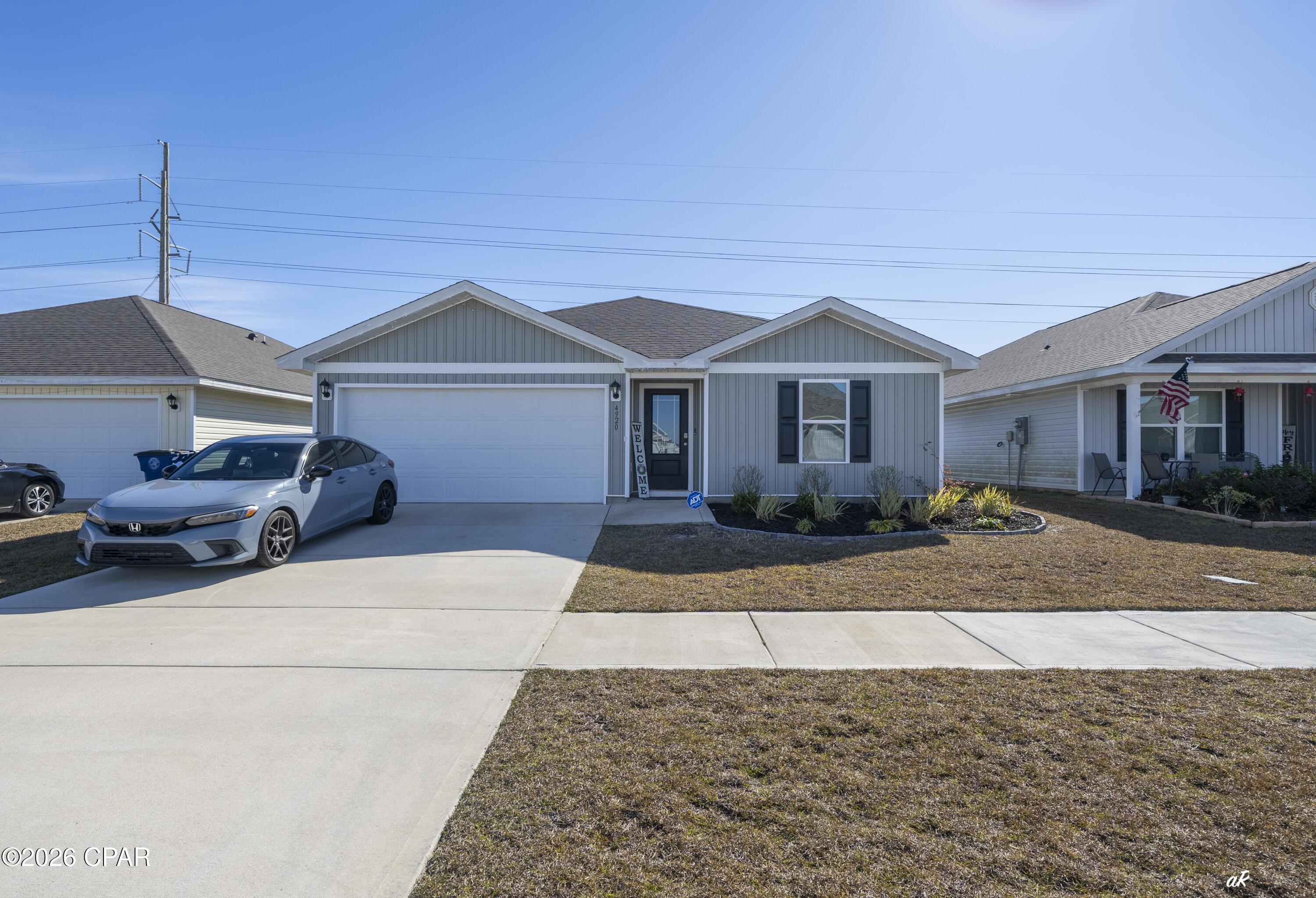 JUST LISTED! The Freeport floor plan in Liberty, just north of Panama City with easy access to Tyndall Air Force Base and all the perks of living in Panama City! This 4 bedroom 2 bath, 1387 square foot, home is an open floor plan with two bedrooms separated by a full bathroom at the front of the home and one bedroom across the entry hallway affording family and friends alike privacy when visiting. The large kitchen island overlooks the dining room and living room. The main areas of the home ,as well as, the bathrooms and laundry have beautiful luxury vinyl plank while the bedrooms offer plush carpeting. The spacious primary bedroom leads to the bathroom featuring a large shower, double vanity, and a large closet. This home also features a vinyl fence around the backyard. Liberty, D.R. Horton's premier new lifestyle community, offers a 7,500 square foot community center with full gym, wellness rooms and much more. Additionally, behind the community center is a water wonderland with resort style pool, splash pads, and an outdoor grilling kitchen with seating.  You will not be disappointed!  Schedule your viewing appointment today!