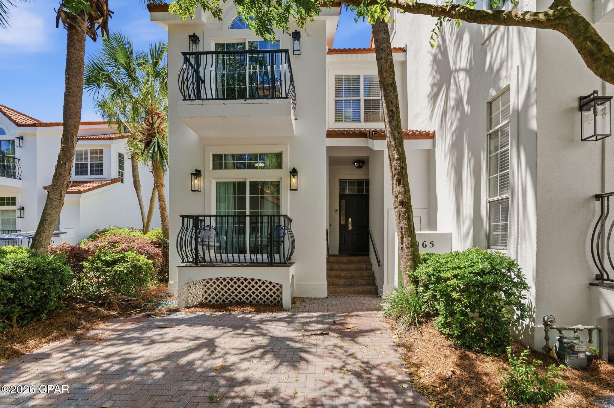 Fully furnished 5BR/3BA townhome in Sandestin, located on the 8th hole with bay views. This 3-level home features high ceilings, a guest room with bath and balcony on the main floor, gourmet kitchen, open living area with fireplace, laundry, and screened-in porch overlooking the golf course. The second level includes a spacious primary suite with vaulted ceiling, sitting area, fireplace, large bath with double closets, tile shower, and private deck, plus 2 more bedrooms and bath. Top floor offers a huge private guest room. Skylight in stairway brings in great natural light. Located in a golf cart-friendly, amenity-rich resort community--perfect as a primary home, second home, or income-producing rental with beaches, golf, and Sandestin's top amenities.