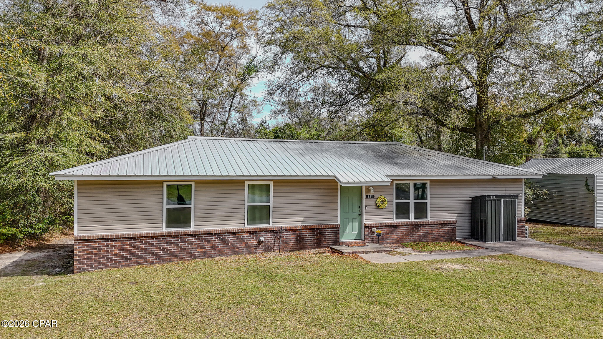 Fully renovated and move-in ready, this 4 bed/2 bath home sits in downtown Chipley but still feels tucked away, with woods behind the property giving it a quieter, more private setting. At 1320SF, the layout is efficient and the fourth bedroom is a great find at this size and price point. New LVP flooring runs throughout, paired with fresh paint, updated lighting, and an all new kitchen featuring new cabinets, quartz countertops and stainless appliances. Both bathrooms have been redone with new fixtures and tub/shower inserts. The big-ticket items are solid too: metal roof, HVAC, and water heater are all just 4 years old, which means no deferred maintenance. The oversized utility room is a standout, with lots of space for laundry + pantry or storage use. Qualifies for all financing types!