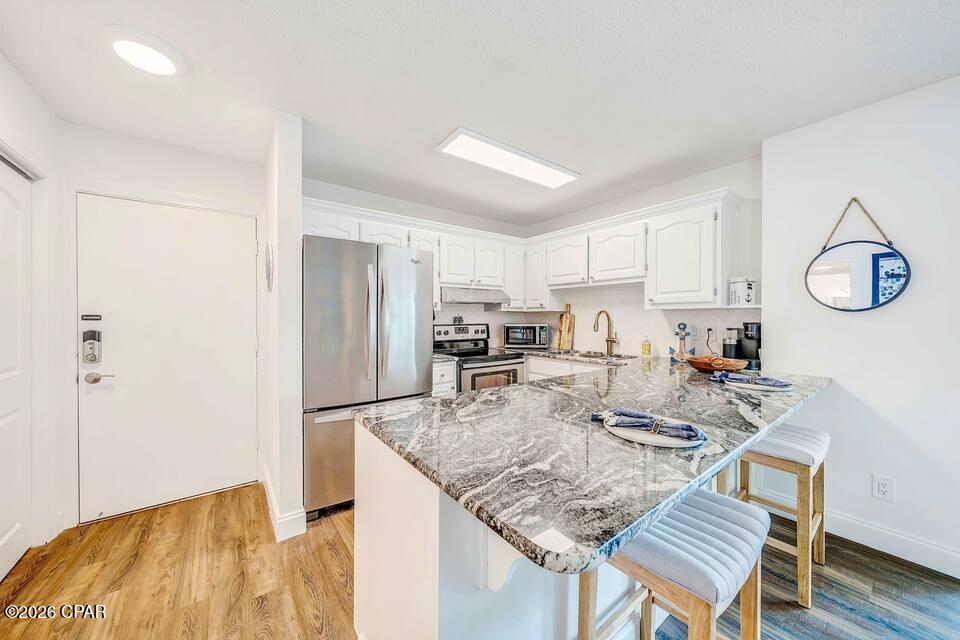 Unit 260 at 4725 Bay Point Rd is where laid-back luxury meets effortless Florida living. Tucked inside the highly sought-after Bay Point community, this charming condo is perfect for anyone craving sunshine, serenity, and a little splash of adventure. Step inside and you're greeted with a bright, airy layout that instantly feels like home. Natural light pours in, highlighting comfortable living spaces that are just right for relaxing after a day on the water or hosting friends for a sunset cocktail. It's all about the lifestyle. Imagine mornings with coffee on your private balcony, gentle breezes in the air, and the peaceful surroundings of one of PCB's most desirable gated communities. Whether you're a boater, golfer, or beach lover, you're right where you want to be. Spend your days exploring nearby marinas, hitting the greens, or taking a quick drive to the sugar-white sands and emerald waters that make this area famous. Then come home to your own quiet retreat, away from the crowds but close to everything. Enjoy the confidence of knowing the HVAC system is 6 years young and the tankless water heater was installed 3 years ago.  Perfect as a full-time residence, vacation getaway, or investment opportunity, this condo delivers coastal charm with endless possibilities. Live where others vacation... and make every day feel like a getaway.  Call your favorite Realtor and set up a showing today!