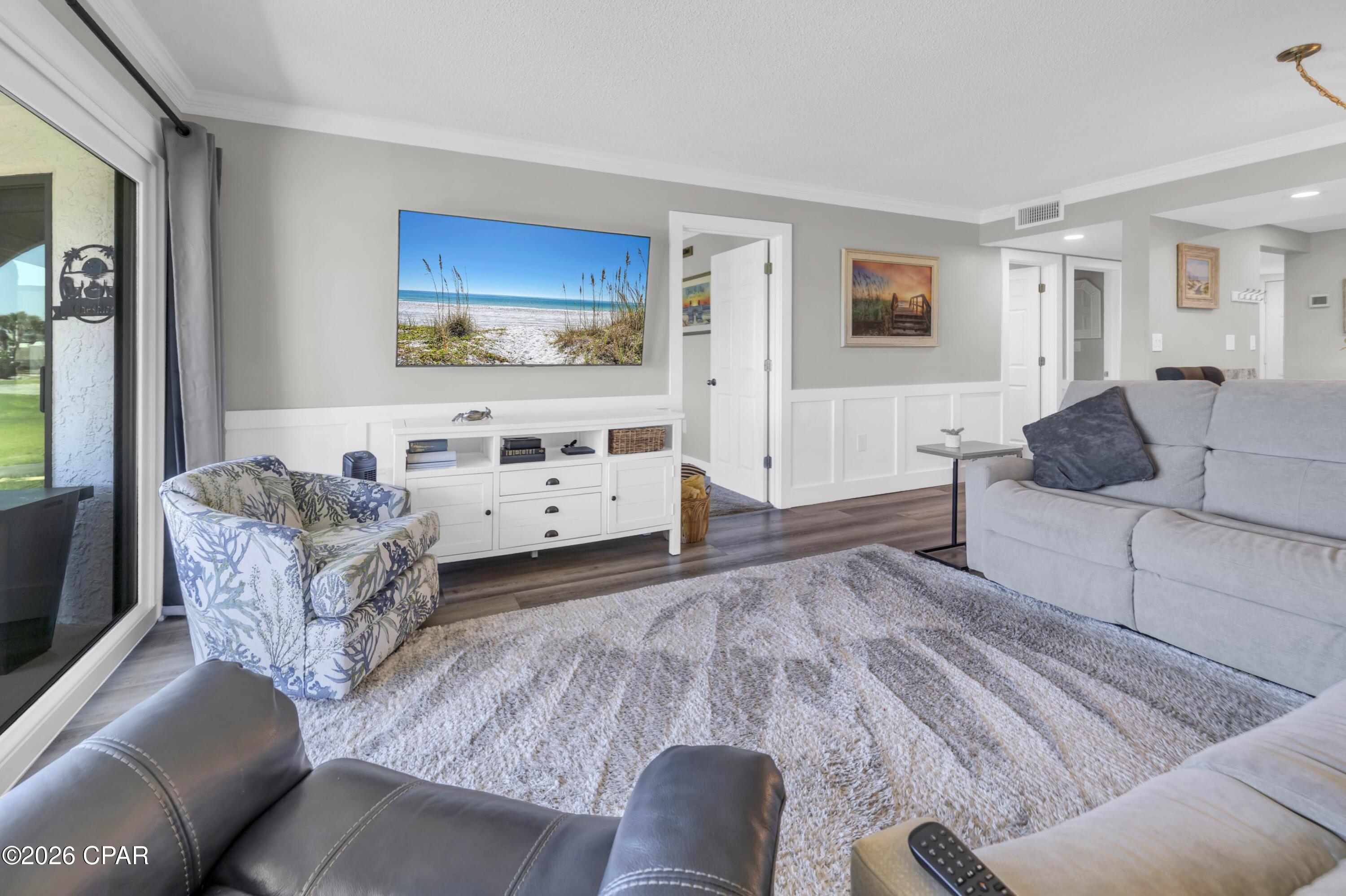 Welcome to the most beautiful Villa in Edgewater Resort! Offered completely turn-key, this stunning unit has been fully renovated and equipped with all the most luxurious finishes. It has been meticulously maintained and the pride of ownership is evident throughout. The interior features a comprehensive remodel with wood-look flooring and elegant wainscoting that adds a level of sophistication. The kitchen is completely reimagined with top-of-the-line granite countertops and custom white cabinetry featuring extra storage. You will find newer stainless steel appliances and designer fixtures that perfectly complement the sleek aesthetic. This high level of finish extends into the bathrooms, which feature gorgeous vanities, modern fixtures, and glass shower doors. The living areas are open and bright with natural light that flows to the spacious balcony. The bedrooms offer a cozy retreat with newer plush carpet.

Beyond the cosmetic beauty, the major systems offer peace of mind with a brand new HVAC, a 2020 water heater, and a 2018 roof. Not only that, but the balcony slider doors have been completely replaced, which is one of the most costly upgrades. This first floor location provides a unique sense of space, offering a sprawling golf course view that creates the feel of a massive backyard. This unit has never been on a rental program and it shows. Although currently only enjoyed as a private residence, this villa has the potential to generate over $35,000 in annual rental income if placed on a short term program. The newer coastal furnishings are negotiable to ensure a seamless transition for the next owner, whether as a primary residence, secondary retreat, or lucrative investment opportunity. 

Edgewater Beach and Golf Resort stands out as the premier destination in Panama City Beach, offering unparalleled amenities along the Emerald Coast. No other complex comes close. The exclusive and extensive amenities include the huge Gulf front lagoon pool, numerous heated pools, and multiple hot tubs. You will enjoy direct beachfront access with an on site restaurant and bar, a pizza café, ice cream shop, and other retail shops right on the property. Stay active in the large fitness center, check out the pickleball, tennis, and shuffleboard courts, play a round on the golf course (free for owners!), or have fun on the splash pad. Edgewater has options for everyone. Additionally, all HOA inspections have been completed and there are no pending special assessments!
Outside the guarded security gates you will find a variety of dining options, from New York style pizza to upscale steak and seafood, plus a myriad of other attractions. With its convenient location, stunning renovations, and position in one of PCB's most sought after resorts, Villa 1204 is a standout opportunity. Schedule your showing today to see what a truly meticulously maintained villa looks like. A video tour is also available