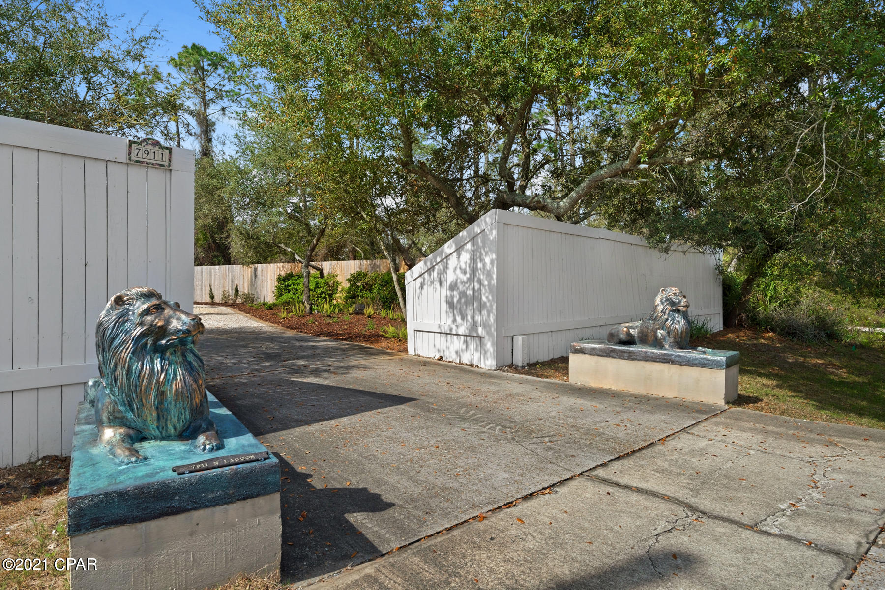 Exquisite estate home, over one acre on the Grand Lagoon. Main home offers 4 or 5 bedrooms all en-suite and an additional office suite. High ceilings, open floor plan, Venetian plaster...There is also a separate 600 SF yoga studio/gym not included in SF. Swimming pool, boat dock...