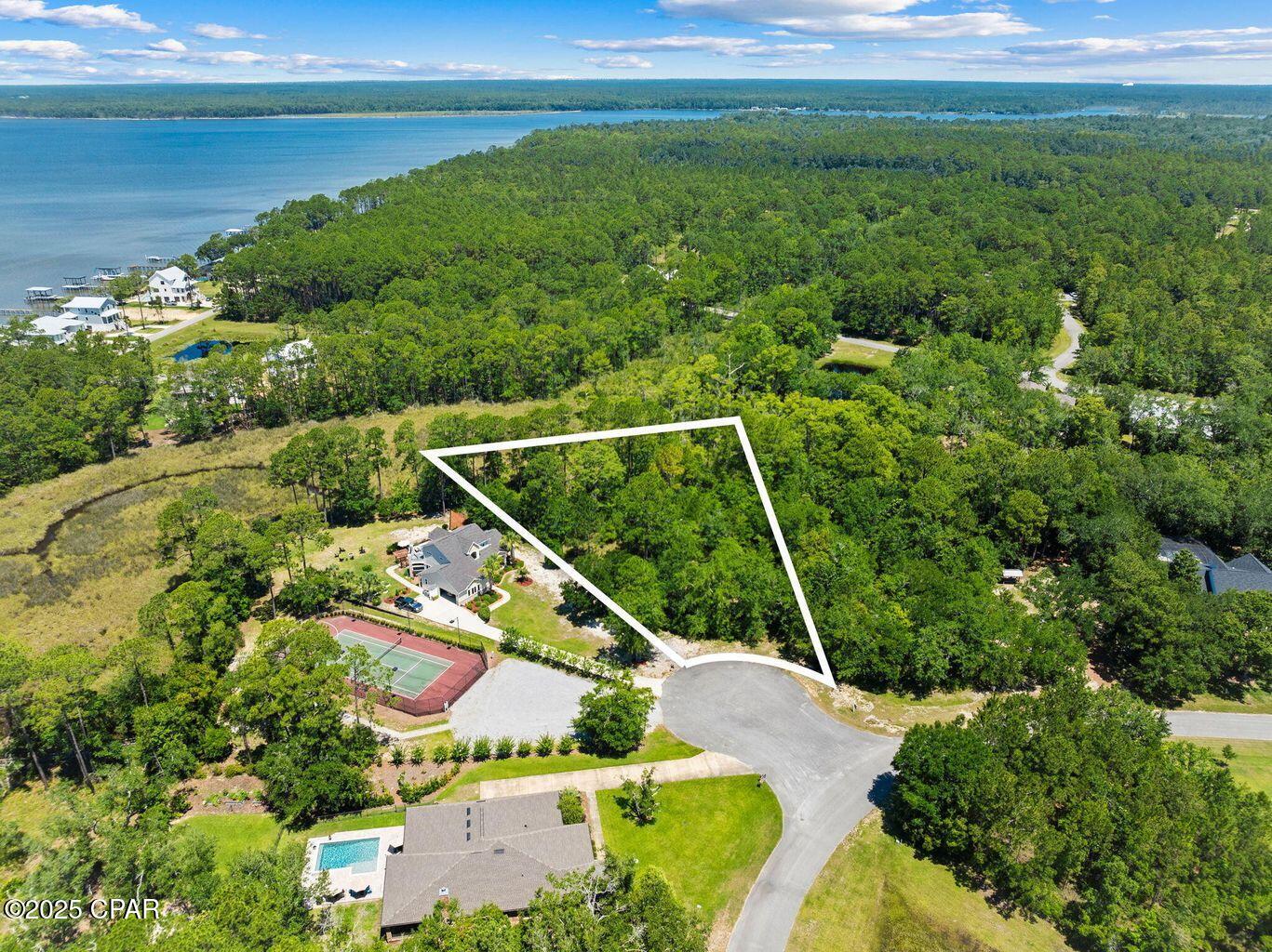 Build your dream home on this exceptional vacant lot in the secluded Bay Harbour community of Freeport, Florida! Tucked away on a quiet cul-de-sac, this property is truly ready to go--saving you time and expense with key due diligence already completed, including a boundary survey, wetland delineation study, and topographical survey. Enjoy a peaceful waterview setting and the natural beauty that surrounds you, all while being just a short stroll from community amenities like tennis courts and a scenic boardwalk leading to Choctawhatchee Bay. Whether you're planning a full-time residence or a serene coastal retreat, this homesite offers the perfect blend of privacy, convenience, and charm. Don't miss your chance to create your own slice of paradise--your sunset views are waiting! Lot 77 is also available.