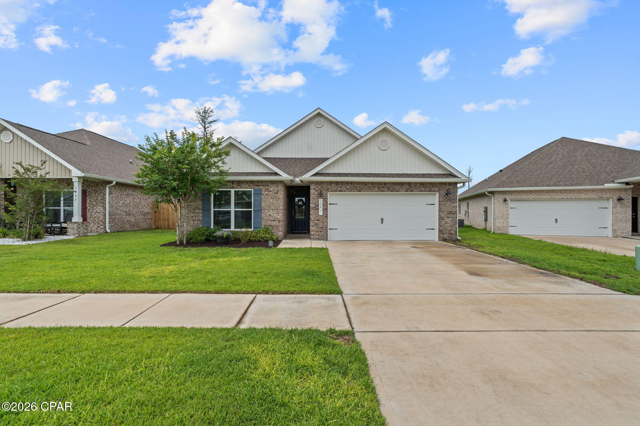 Welcome to this beautifully maintained all-brick 4 bedroom, 2 bath home located in the Andrews Plantation neighborhood in Lynn Haven! Conveniently located near Bay Haven Charter Academy and Mosley High School, this home offers comfort, efficiency, and an unbeatable location. Inside, you'll find a spacious split floor plan with ceiling fans and blinds in every bedroom. The kitchen features granite countertops, stainless steel appliances, and a large pantry. Enjoy relaxing or entertaining outdoors in the fenced backyard complete with a covered back patio and outdoor TV -- perfect for game days or quiet evenings at home. The 2-car garage provides additional storage and convenience. A standout feature of this home is the solar panels, helping keep average electric bills around just $30 per month -- a huge savings for tenants! Don't miss your chance to live in this neighborhood close to schools, shopping, dining, and everyday conveniences.