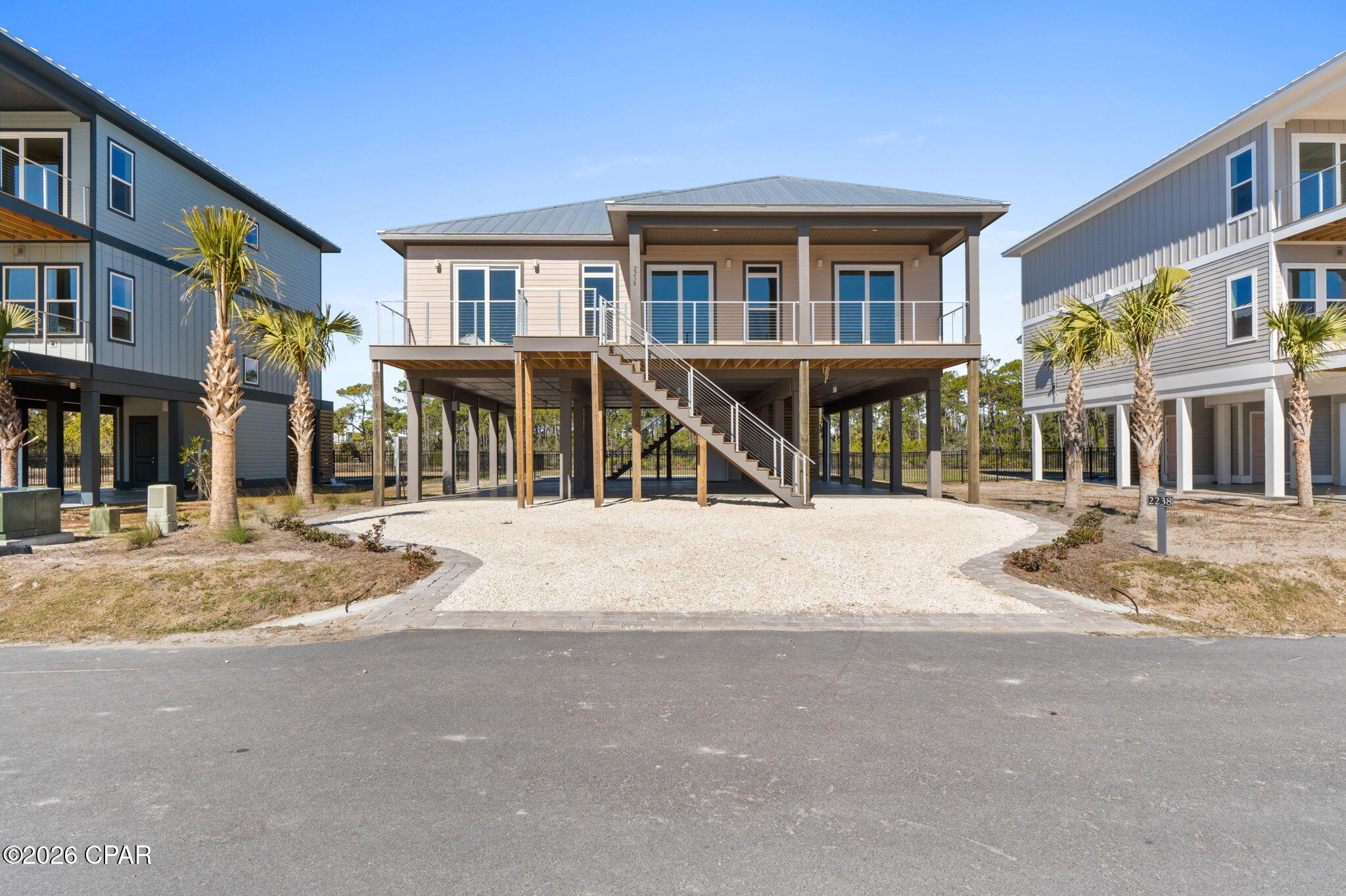 COASTAL ELEGANCE WITH RELAXED ISLAND LIVING! Discover the ease of single-level living in this beautifully designed home at 2238 Nella Nook St, located in Heron's Crossing within Casa Del Mar at The Plantation on St. George Island. With 4 bedrooms, 4 bathrooms, and 2,140 square feet of thoughtfully crafted space, this residence blends refined finishes with the laid-back rhythm of coastal life. Designed for comfort and connection, the open-concept layout is filled with natural light and oriented to capture peaceful water views. At the heart of the home, a chef's kitchen stands out with high-end appliances, custom cabinetry, and premium countertops--perfect for entertaining or enjoying relaxed evenings after a day on the beach. The living and dining areas flow effortlessly to outdoor spaces, creating a seamless indoor-outdoor experience. Step outside to your private inground pool, where days are spent soaking up the sun and evenings unwind with coastal breezes and tranquil surroundings. Each bedroom offers its own sense of privacy and comfort, making the home ideal for full-time living, a luxury getaway, or a strong rental opportunity. Located within the gated Plantation community, residents enjoy access to pristine beaches, scenic trails, and the unspoiled beauty that defines St. George Island. From morning walks along the shore to boating, fishing, and sunset views, every day here feels like a retreat. This is more than a home--it's a lifestyle defined by simplicity, beauty, and the freedom to truly Live the Beach Life.