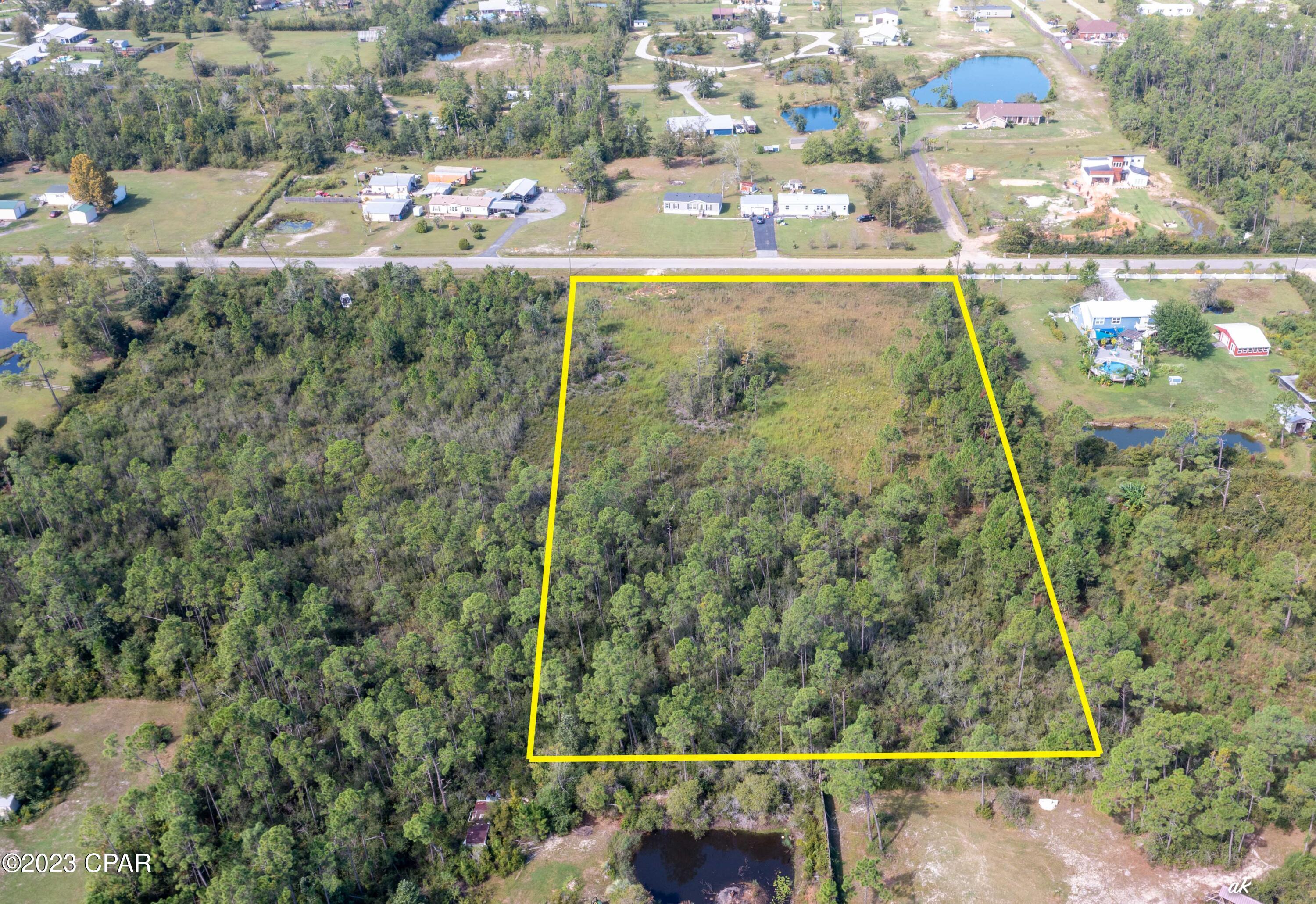 5+/- acre lot located on Holland Road in Southport, Florida - just north of Lynn Haven. Any lot that is larger than 2 acres on Holland Road is a rare find. This lot is perfect for a buyer that is looking to build a large homestead. This lot is close to everything you need, shopping, restaurants, but still has the quiet and quaint feel of country living.
There is also a 3 acre parcel south of this parcel for sale.