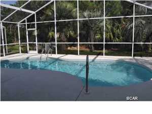 Welcome to The Glades, where you'll find this wonderful patio home with screen-enclosed lanai and in-ground pool. This is a move-in ready home that features the popular open-floor plan with split-bedrooms. Interior highlights include custom built-in bookshelves surrounding the fireplace, skylights, lots of closet space, ceiling fans in all bedrooms and the living room, and a professional level gas range with griddle insert and warming shelves in the kitchen. Once you cook on it, you'll never want to eat out again! All appliance convey including the washer and gas dryer, the patio furniture stays, there is a natural gas valve in the lanai for a grill or heater, and additional cabinets haven been installed in the laundry room and garage. If you're a golfer, you'll love living right on the 5th hole of the ''Ugly'' of The Hombre golf course. The location is perfect too; you're less than five minutes from schools, restaurants, shopping centers, the beaches and more. Get ready to put out the welcome mat! All info is approx and must be verified by Buyers if important. Seller is an Active Florida Broker.