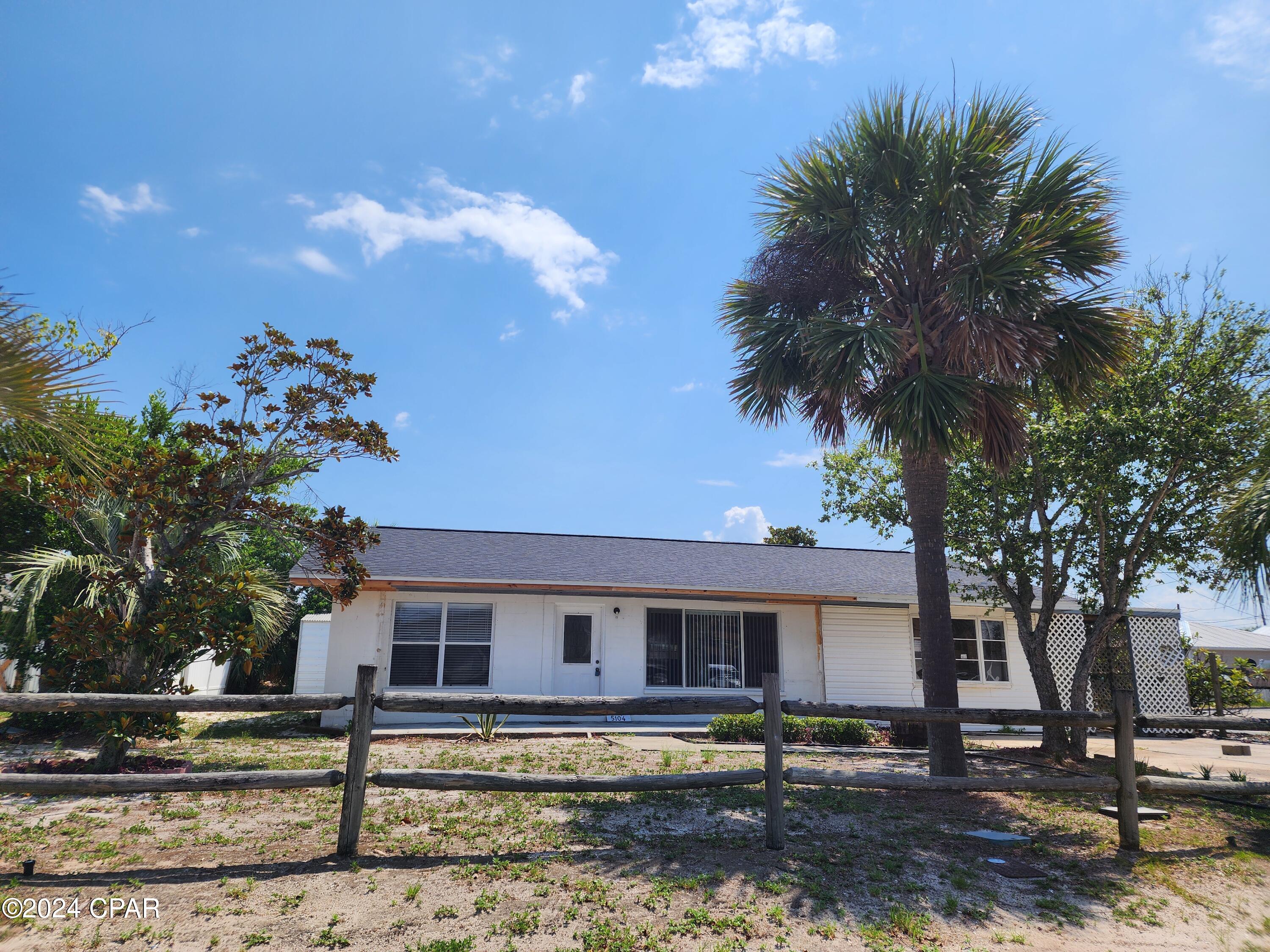 Beach cottage - this 2 bedroom 1.5 bath home features open living room with built-in bookshelves, breakfast bar and bonus room with 1/2 bath. Covered patio for enjoying your evenings. Back yard features large shed with electricity. Home is located on a corner lot. Property is on septic system. No Pets