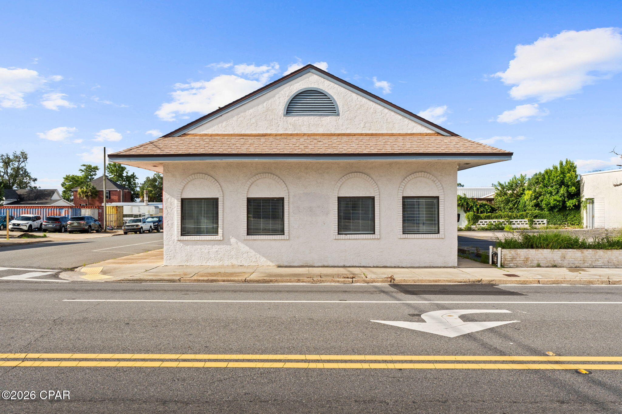 Located in the heart of Downtown Panama City, this 2,328± SF professional office building sits on a highly visible corner lot with approximately 20 private parking spaces and additional adjacent public parking. Formerly utilized as a medical office, the property is configured with 6-7 exam rooms, a reception and nurses' area, waiting room, private offices, and an upstairs space suitable for storage or a lounge. Dual access points from 6th Street and Mercer Avenue provide convenient entry and circulation. Built in 1982 with a roof replacement in 2018, the property is well suited for a medical practice, med spa, professional office, wellness center, or customized build-to-suit opportunity in Panama City's growing downtown district.