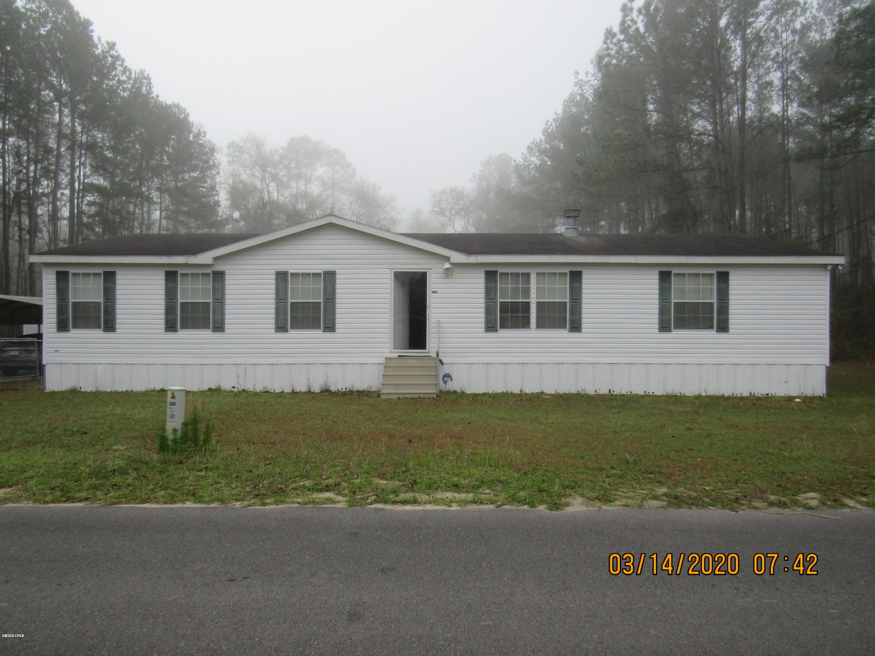 Location is Key with this move in ready property. You get the peace and quiet of country living and less than an hour from The World's Most Beautiful Beaches, Tyndall Air Force Base, Famous Pier Park Shopping, Camping, Kayaking, Canoeing, and some of the best Fishing on the planet Saltwater & Freshwater. Visit some of the worlds most pristine natural cold water springs nearby. This 1 1/2 acre property is fenced in the back and comes with a spacious outbuilding and carport. It was used as a getaway home so it has been kept in great shape. Large bedrooms, double vanities, walk-in closets, breakfast bar, large back deck.  NOW is the time to come and see this one for yourself. Call today for your private tour.